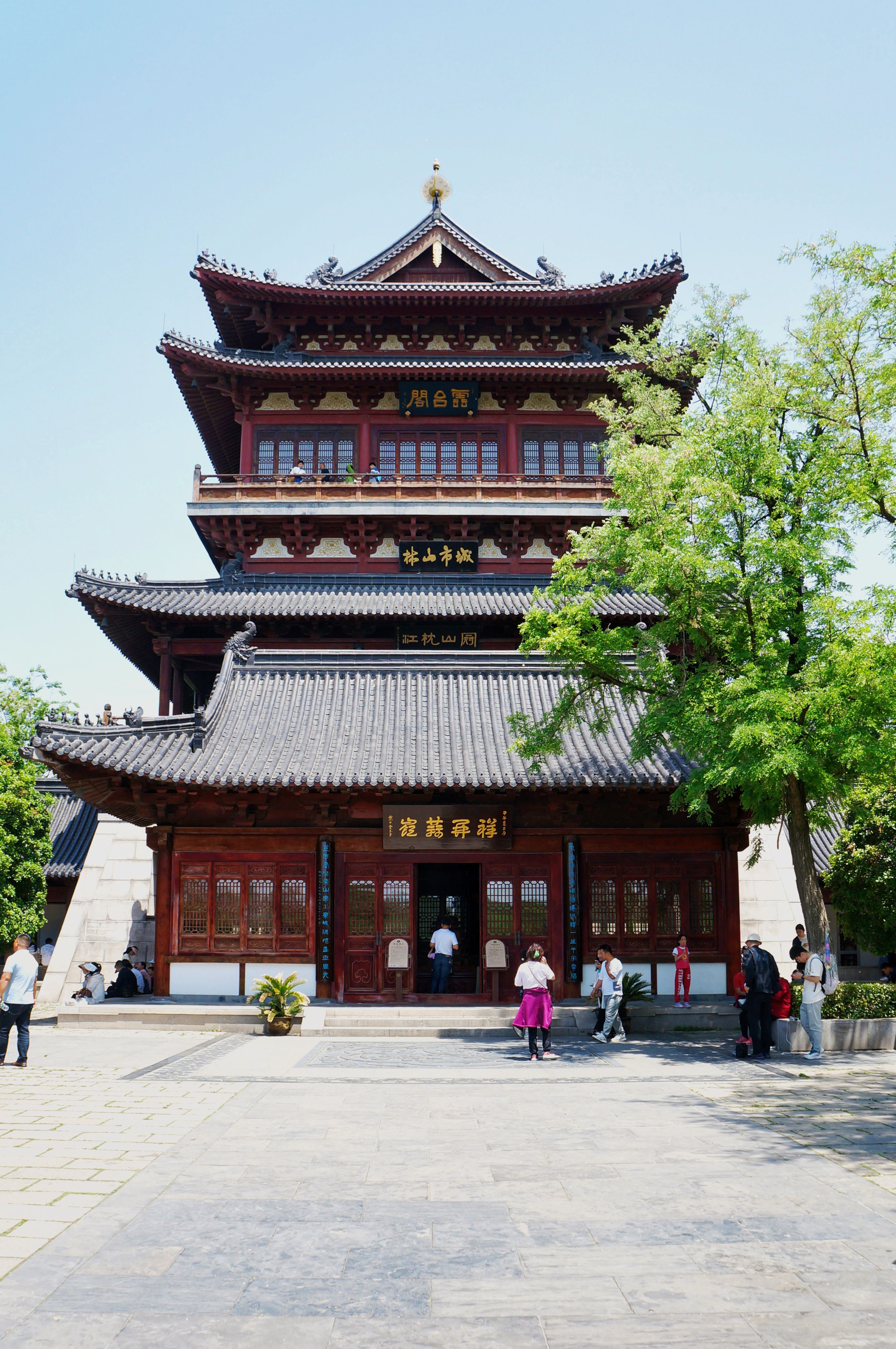 Explore the intricate details of a traditional Chinese temple surrounded by nature.