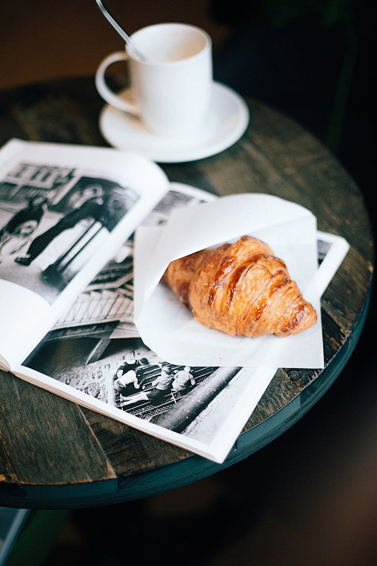 Bread On Wood Table And Ceramic Cup