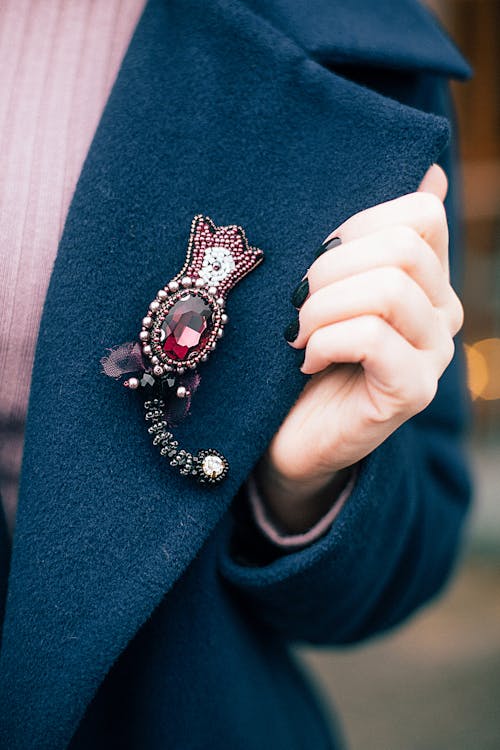 Woman Wearing Blue Coat with Jewelry