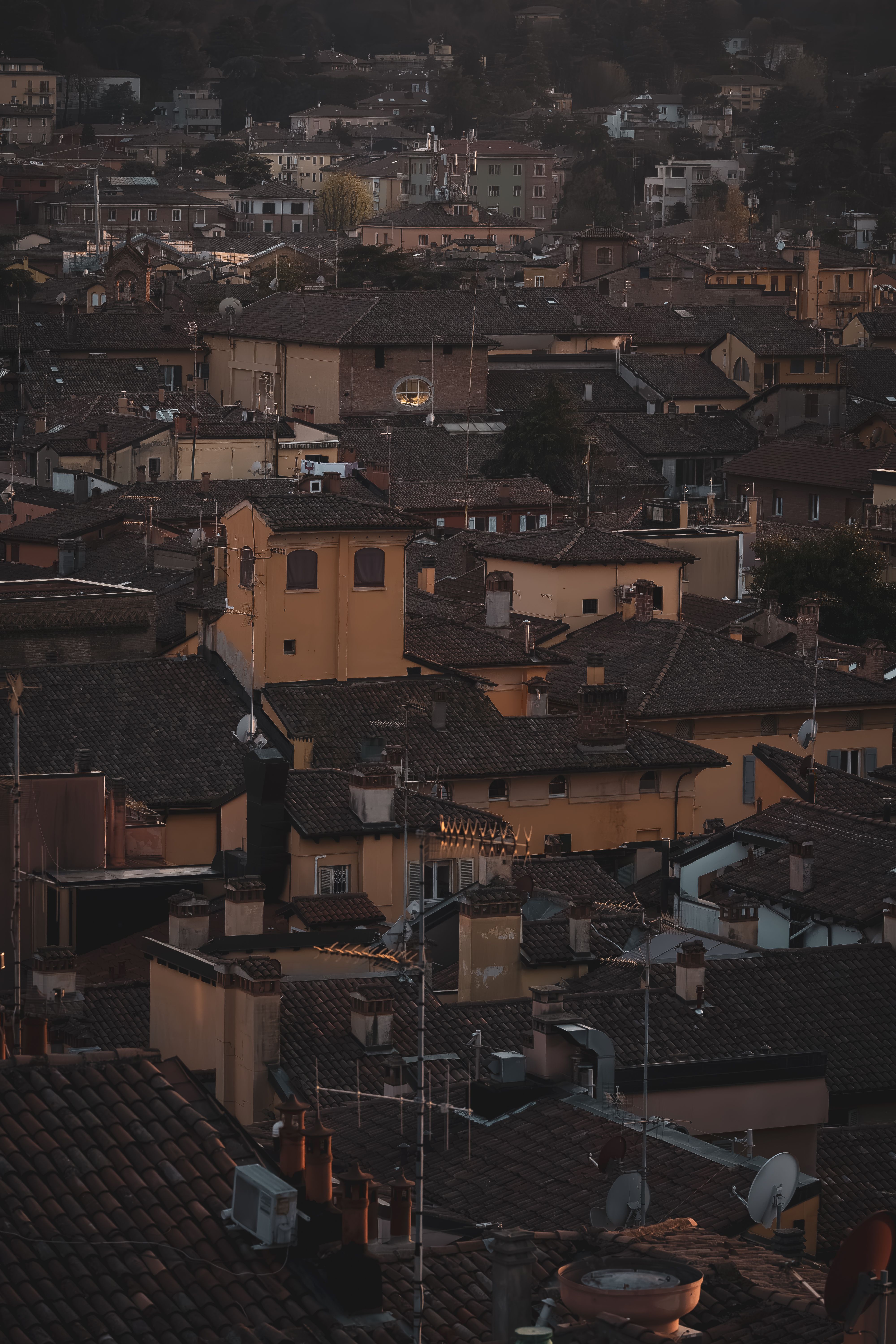 Aerial view of historic European rooftops at dusk · Free Stock Photo
