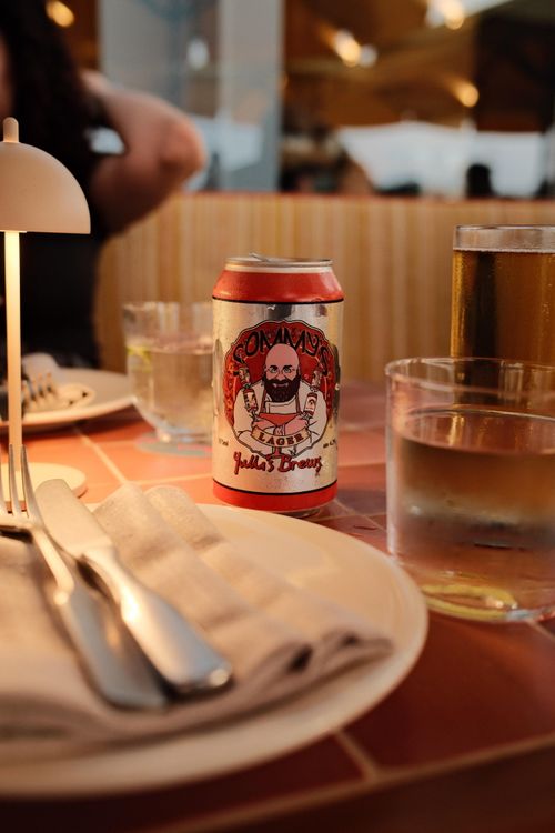 Free A warm dining setting with drinks and beer can at a Sydney restaurant. Stock Photo