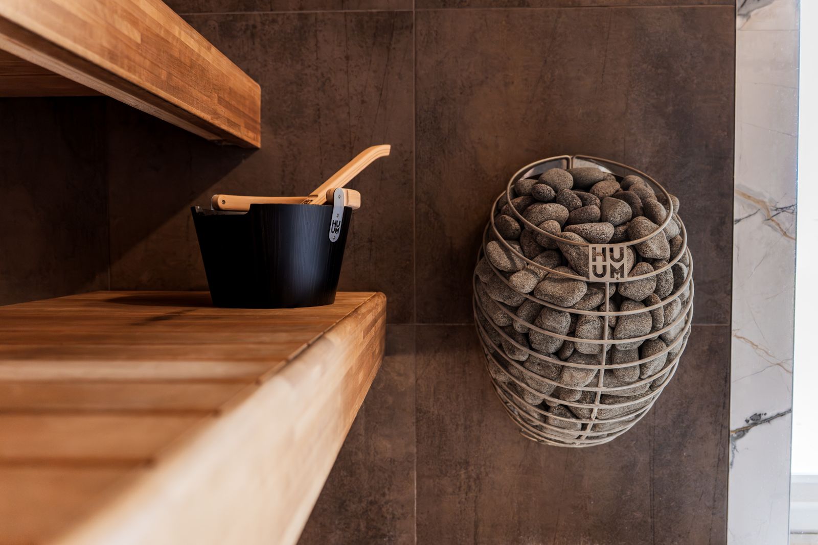 Modern sauna with clean timber finishes as the centrepiece of a wellness space.