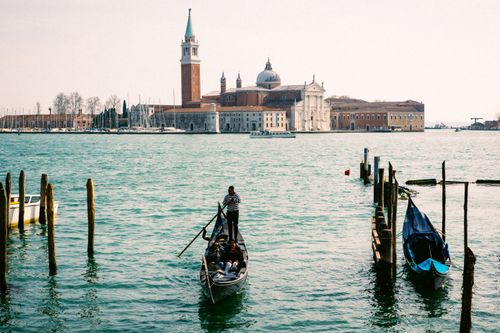 Free Scenic view of a gondola ride with San Giorgio Maggiore in the background, Venice, Italy. Stock Photo