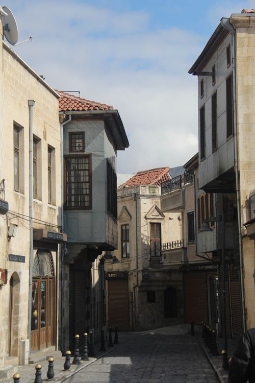 Free Explore a quaint European alley showcasing traditional stone buildings and historic architecture. Stock Photo