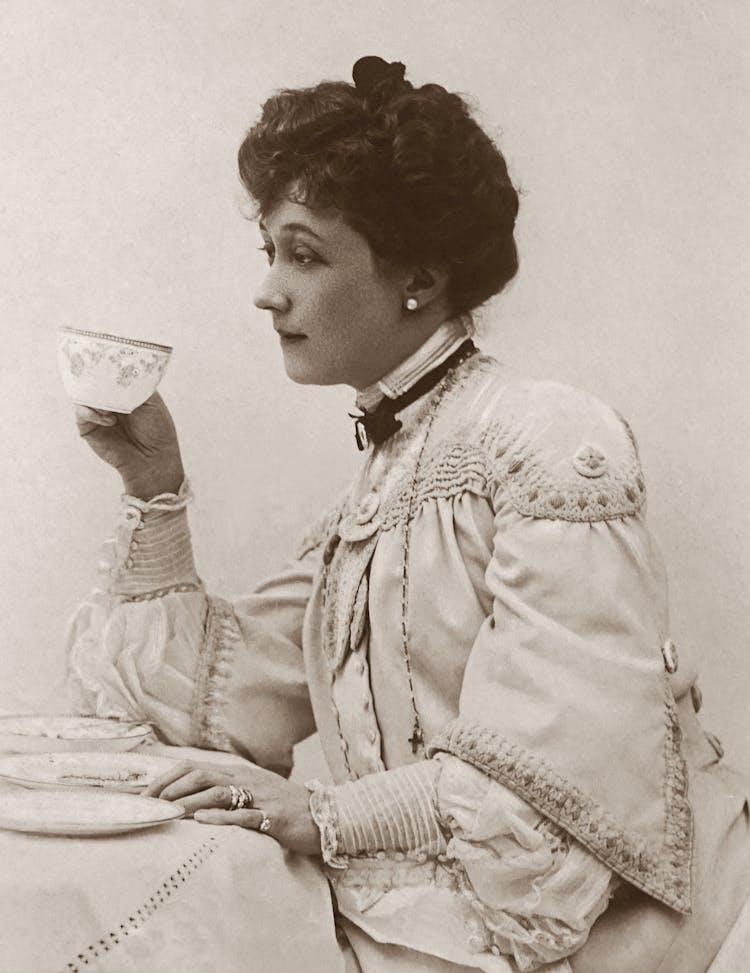 Classic Photo Of A Woman Holding A Tea Cup