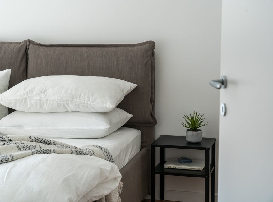 professionally staged master bedroom with white linens and soft lighting - staging home for sale professionally staged master bedroom with white linens and soft lighting - staging home for sale