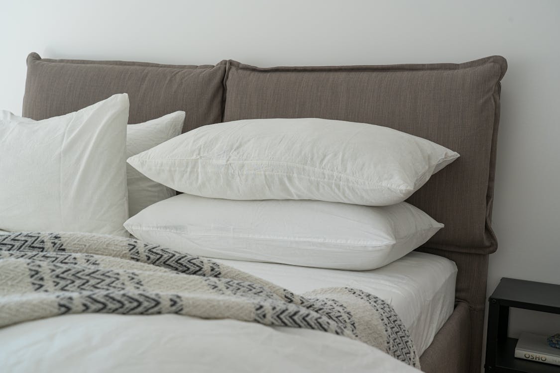 White Pillows on a Bed in home