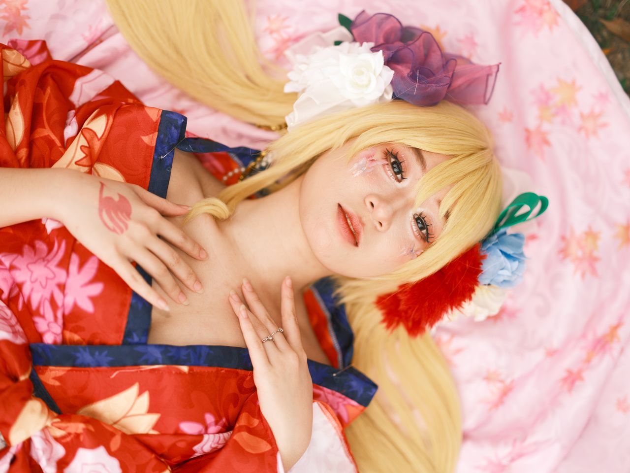 colorful cosplay portrait with floral accessories and traditional atti