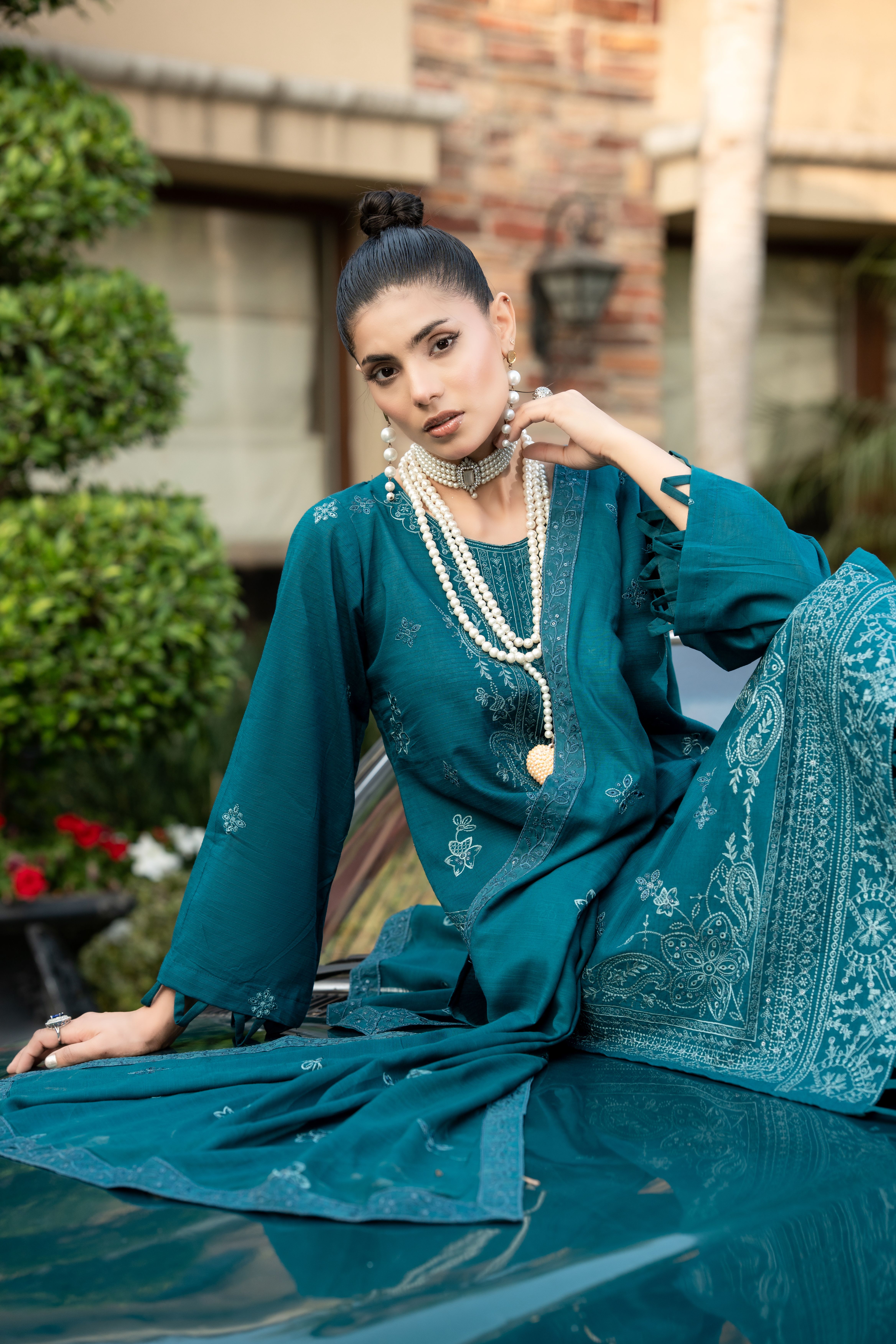 Elegant Woman Posing Outdoors in Traditional Dress · Free Stock Photo