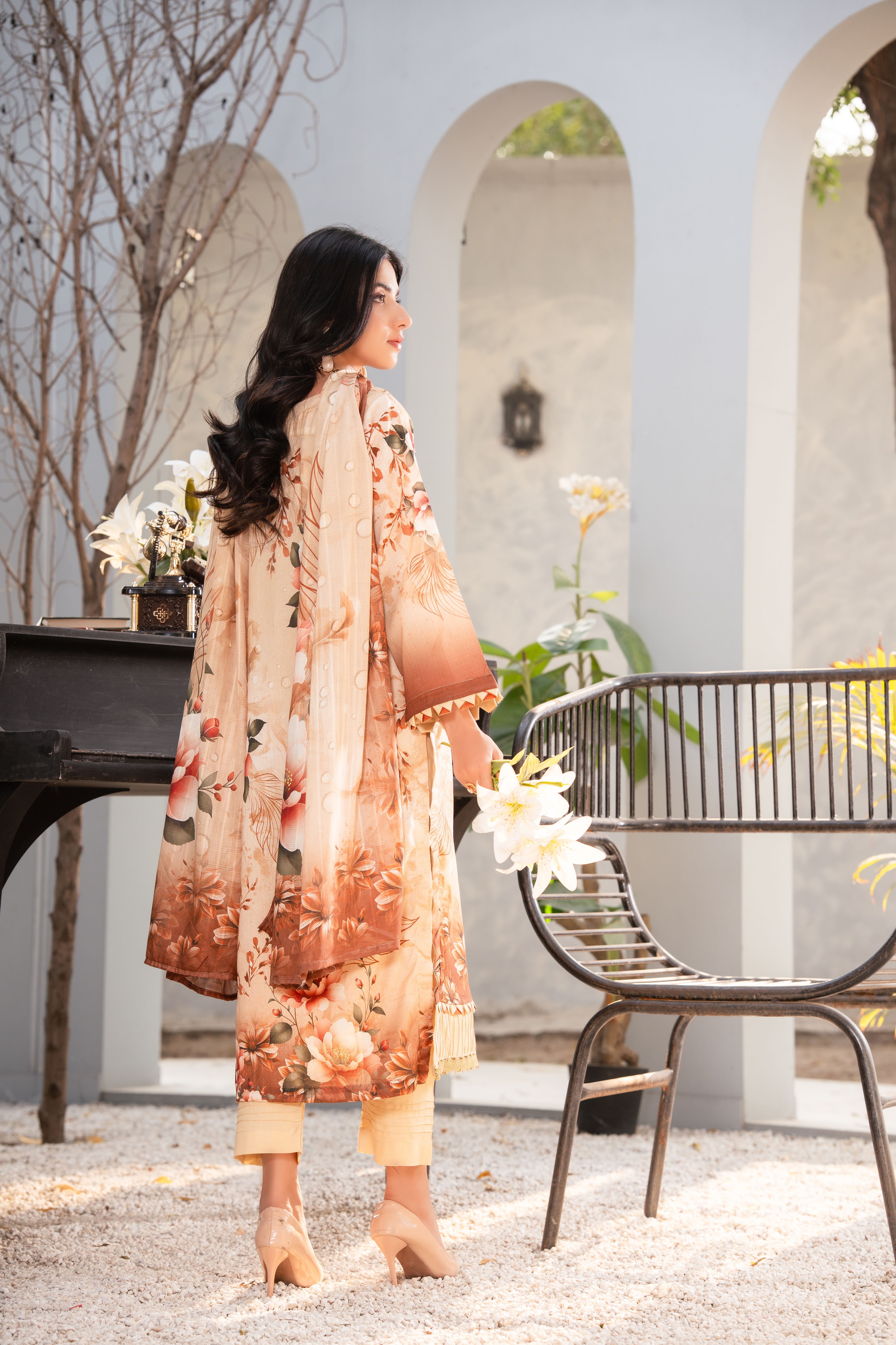 Elegant Woman in Floral Traditional Dress Outdoors · Free Stock Photo