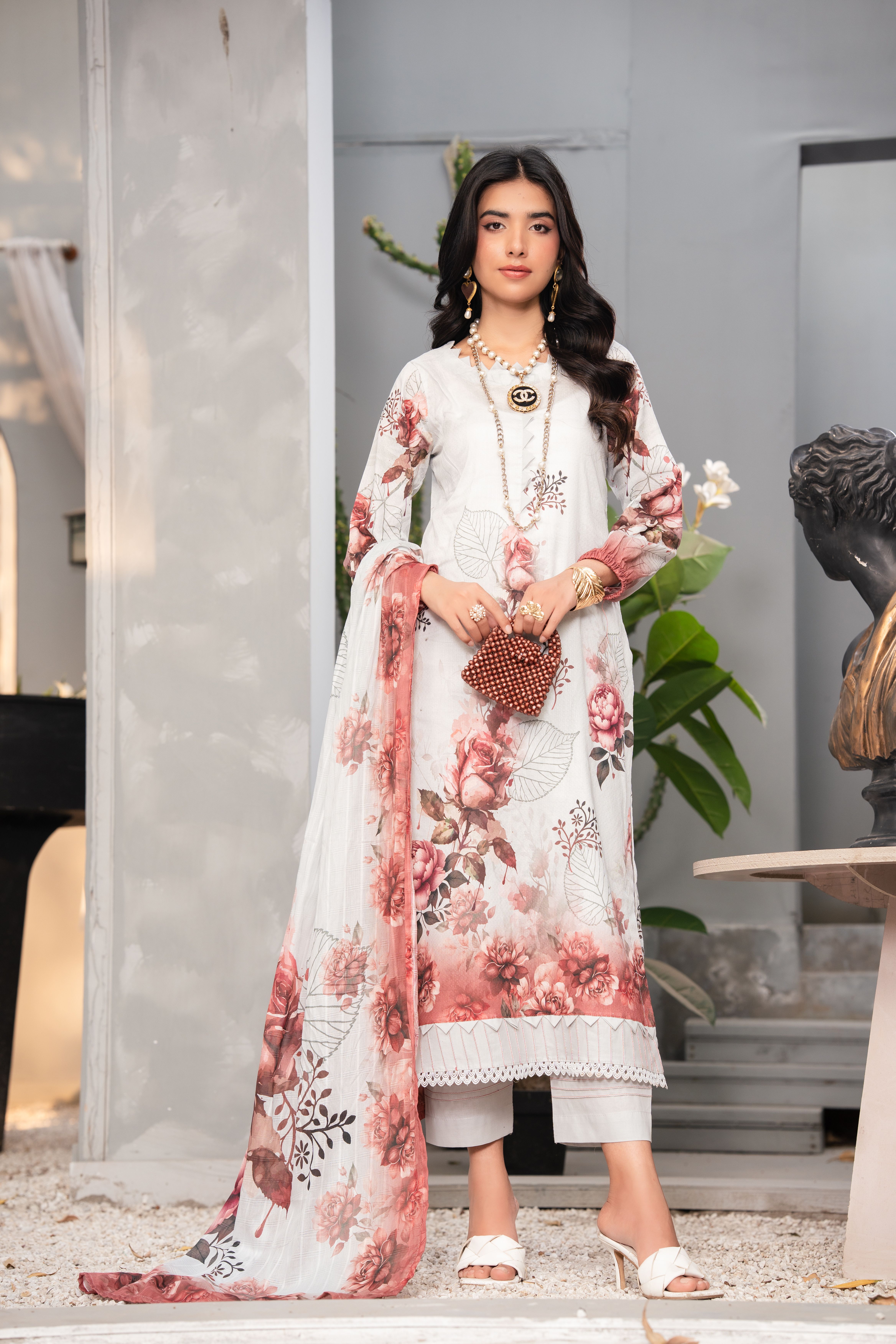 Elegant Woman in Floral Traditional Dress Outdoors · Free Stock Photo