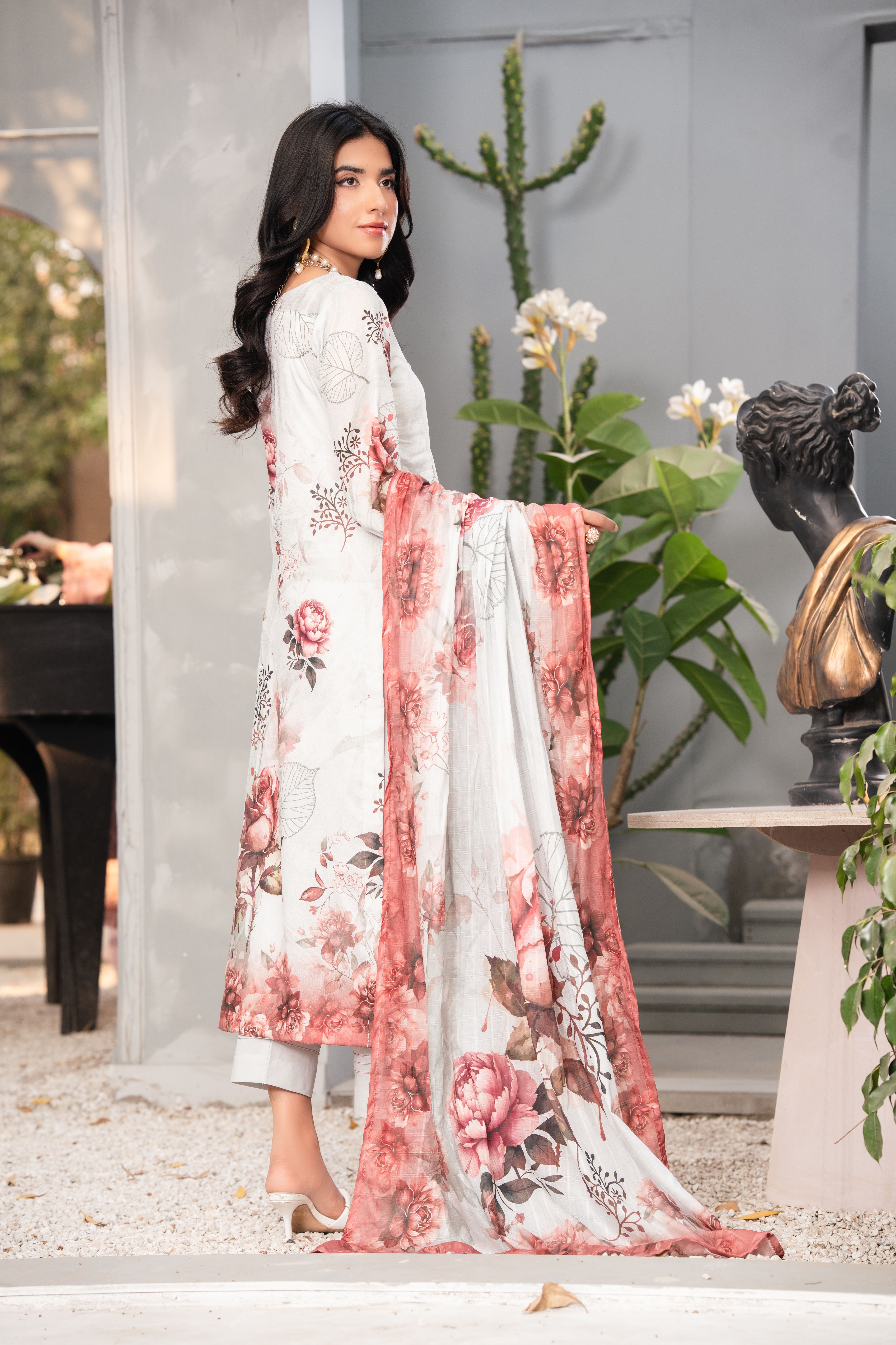 Elegant Woman in Floral Traditional Dress Outdoors · Free Stock Photo