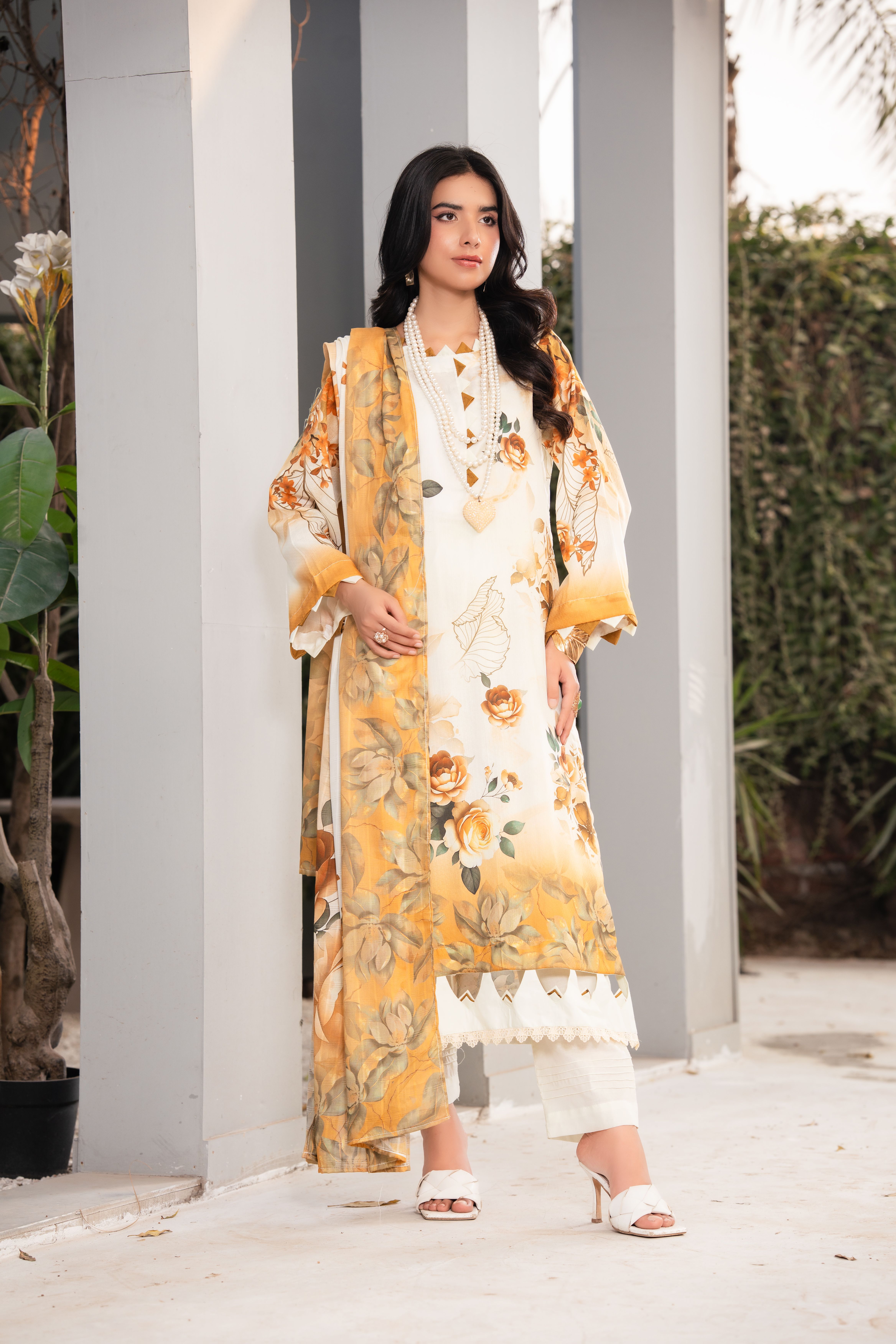 Elegant Woman in Floral Traditional Dress Outdoors · Free Stock Photo