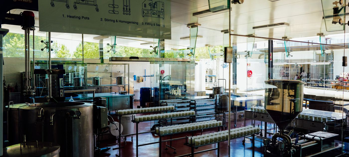 Interior of a modern food production plant with industrial machinery — pest risk in a processing facility is managed by zone