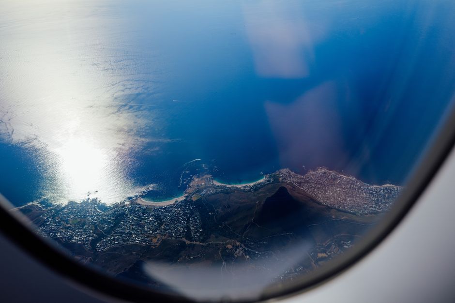 Unforgettable 30min Harbour Boat Cruise Cape Town Review: Your Gateway to Cape Town's Spectacular Waterfront Views Review 2026 - Stunning aerial view over Cape Town, featuring ocean and coastline, seen from an airplane window.