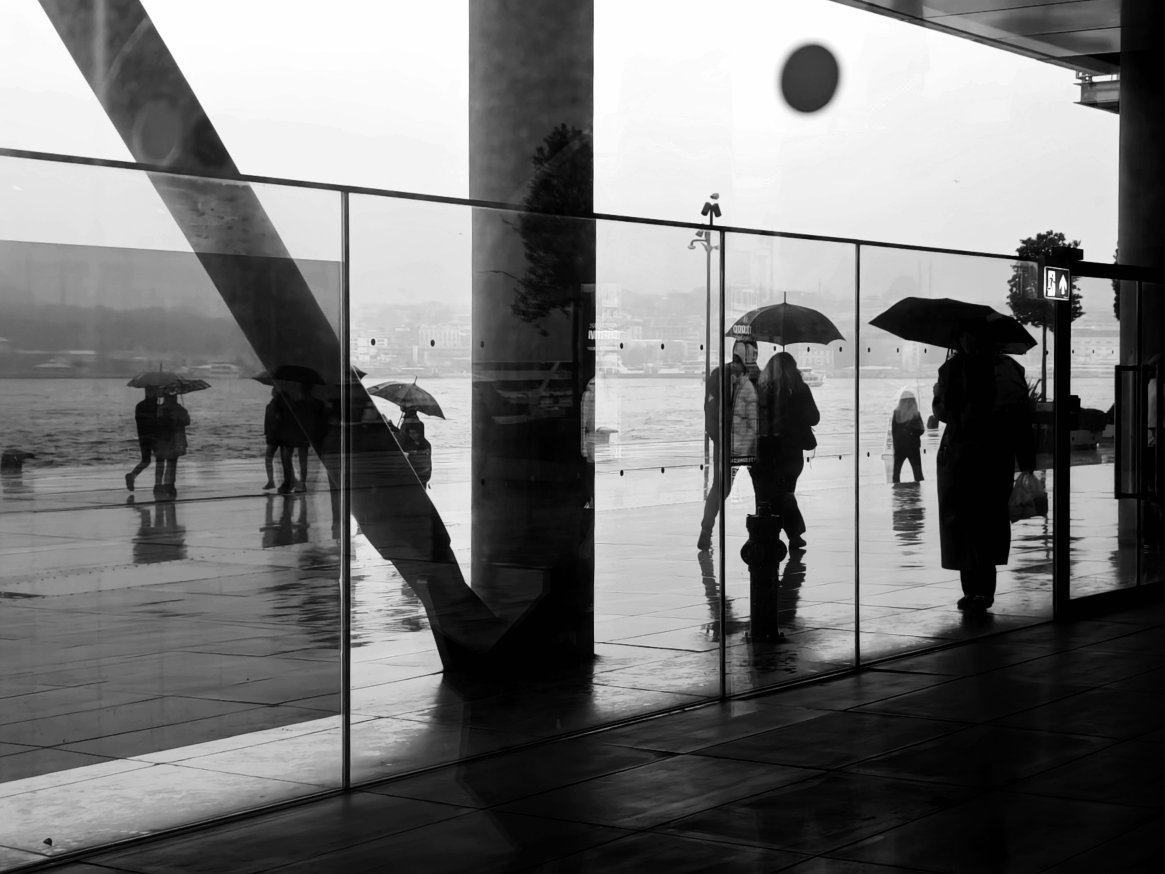 Reflections of Umbrella Walkers on Rainy Day in Istanbul · Free Stock Photo