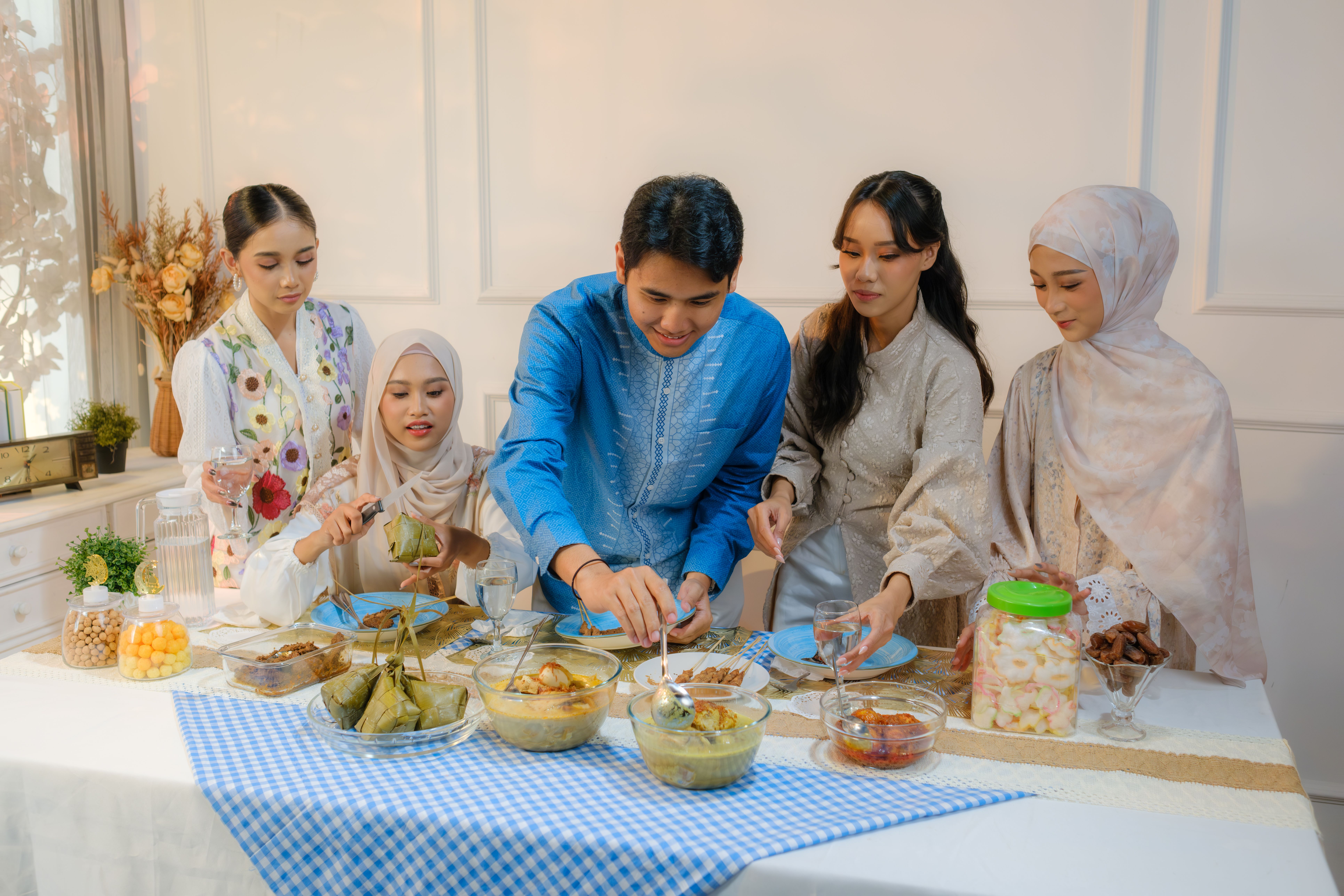 Indonesian family enjoying a festive meal during Ramadan in Jakarta.