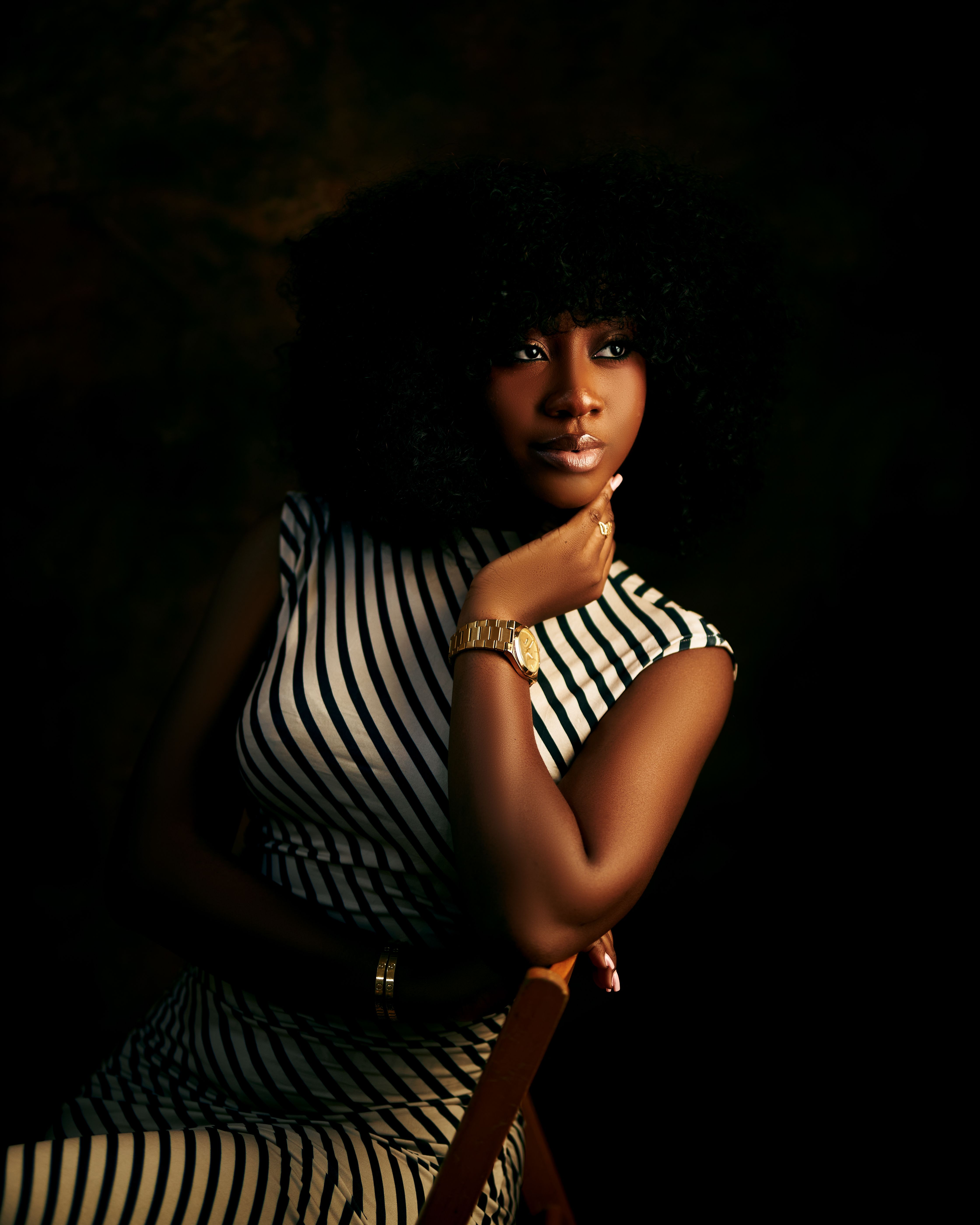 Elegant Portrait of Woman in Striped Dress · Free Stock Photo