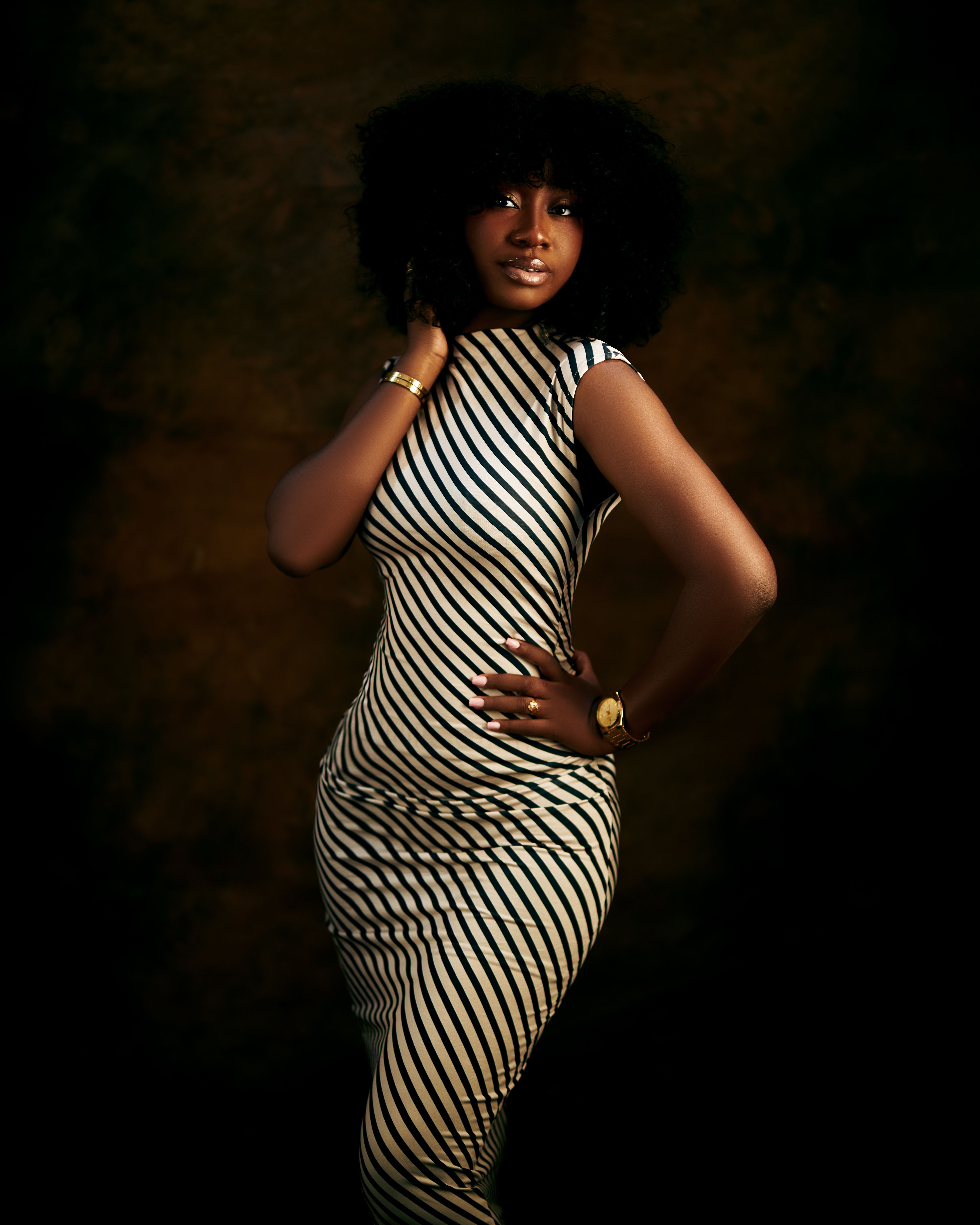 Elegant Woman in Black and White Striped Dress · Free Stock Photo
