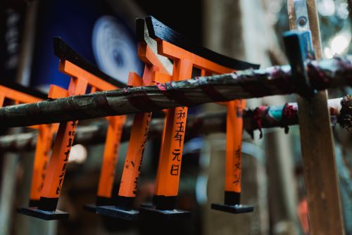 Free Detailed close-up of orange miniature Torii gates with inscriptions, showcasing Japanese culture. Stock Photo