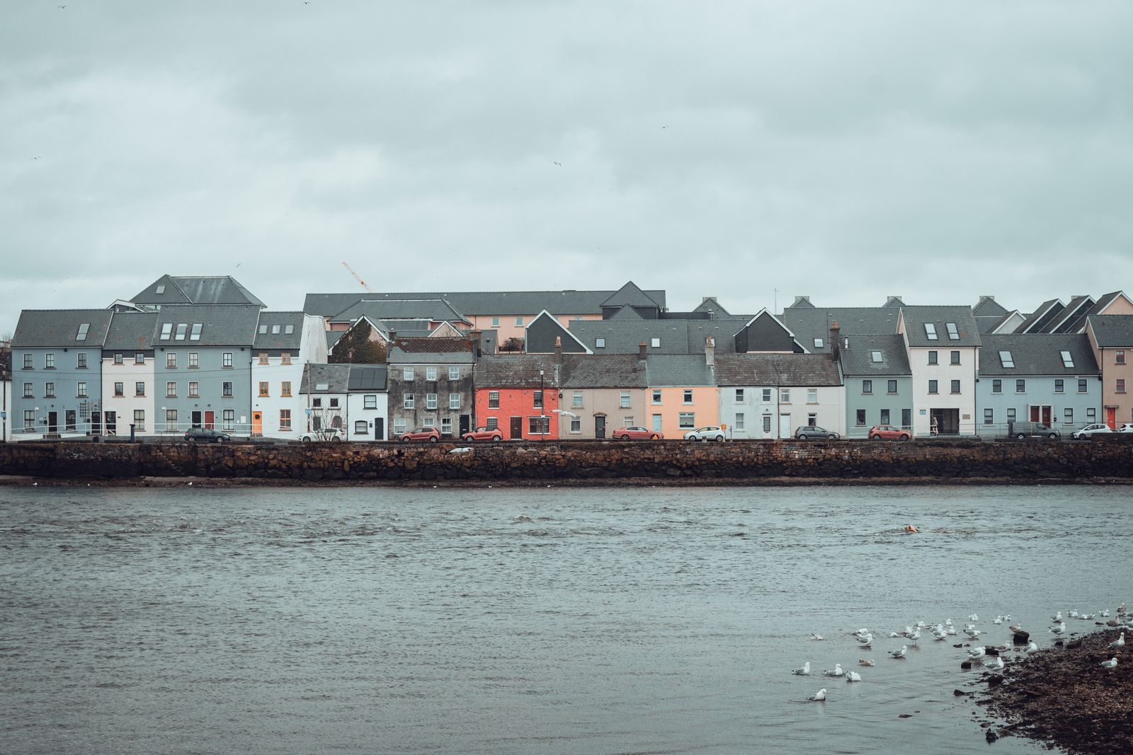 Colorful houses along the riverfront in Galway, Ireland