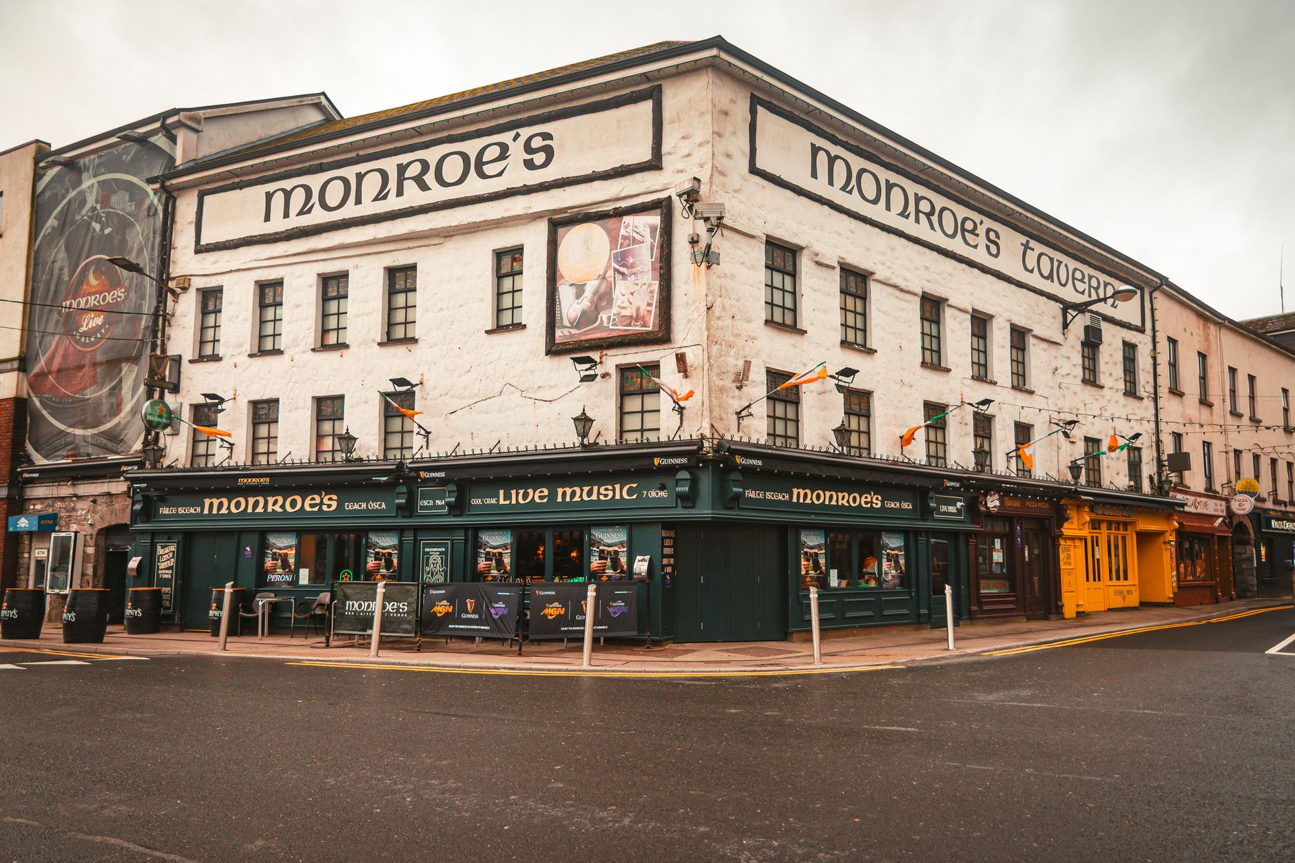A vibrant street view of Monroe's Tavern in Galway, Ireland with traditional Irish decor.