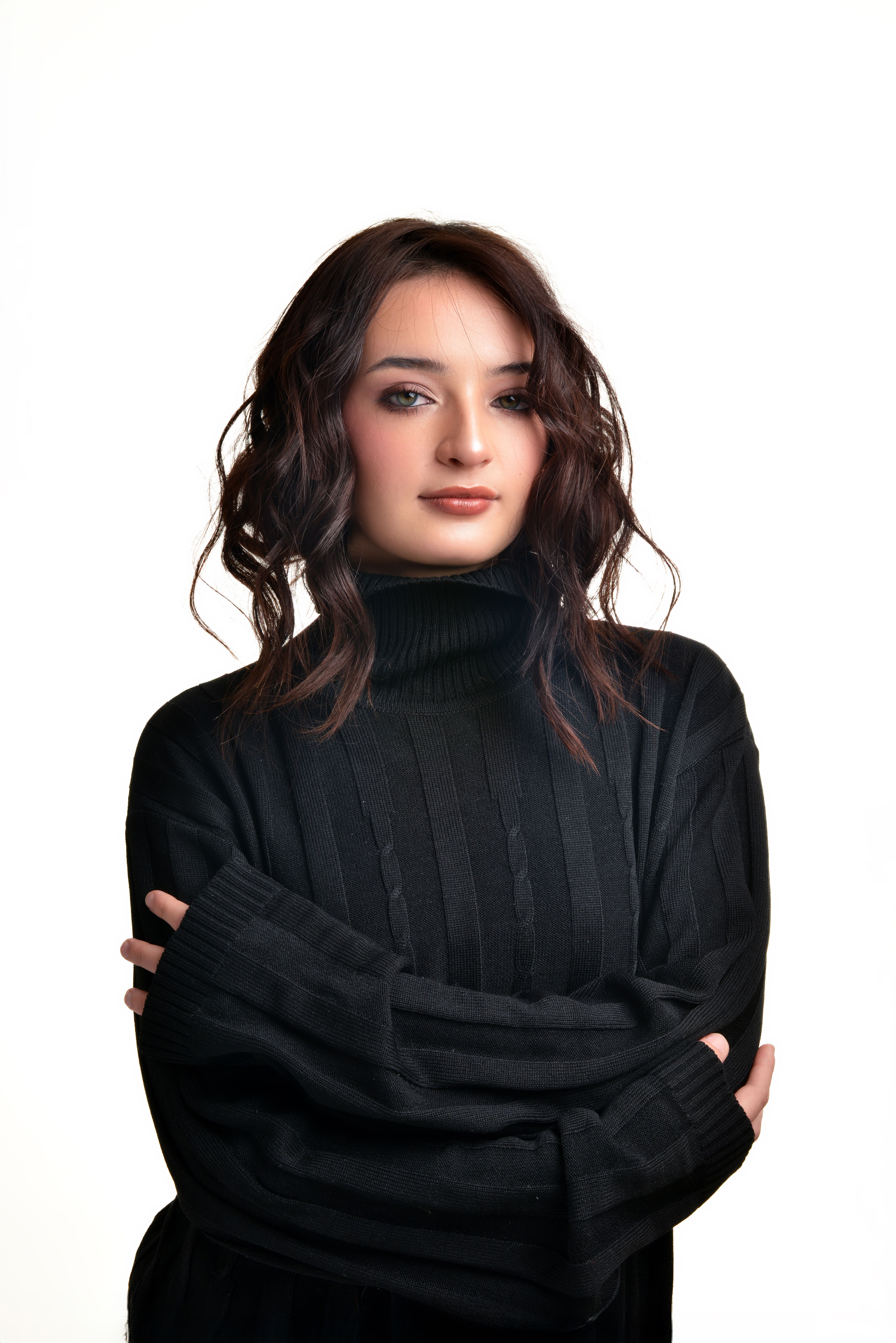 Stunning portrait of a woman wearing a black sweater, exuding confidence and style.