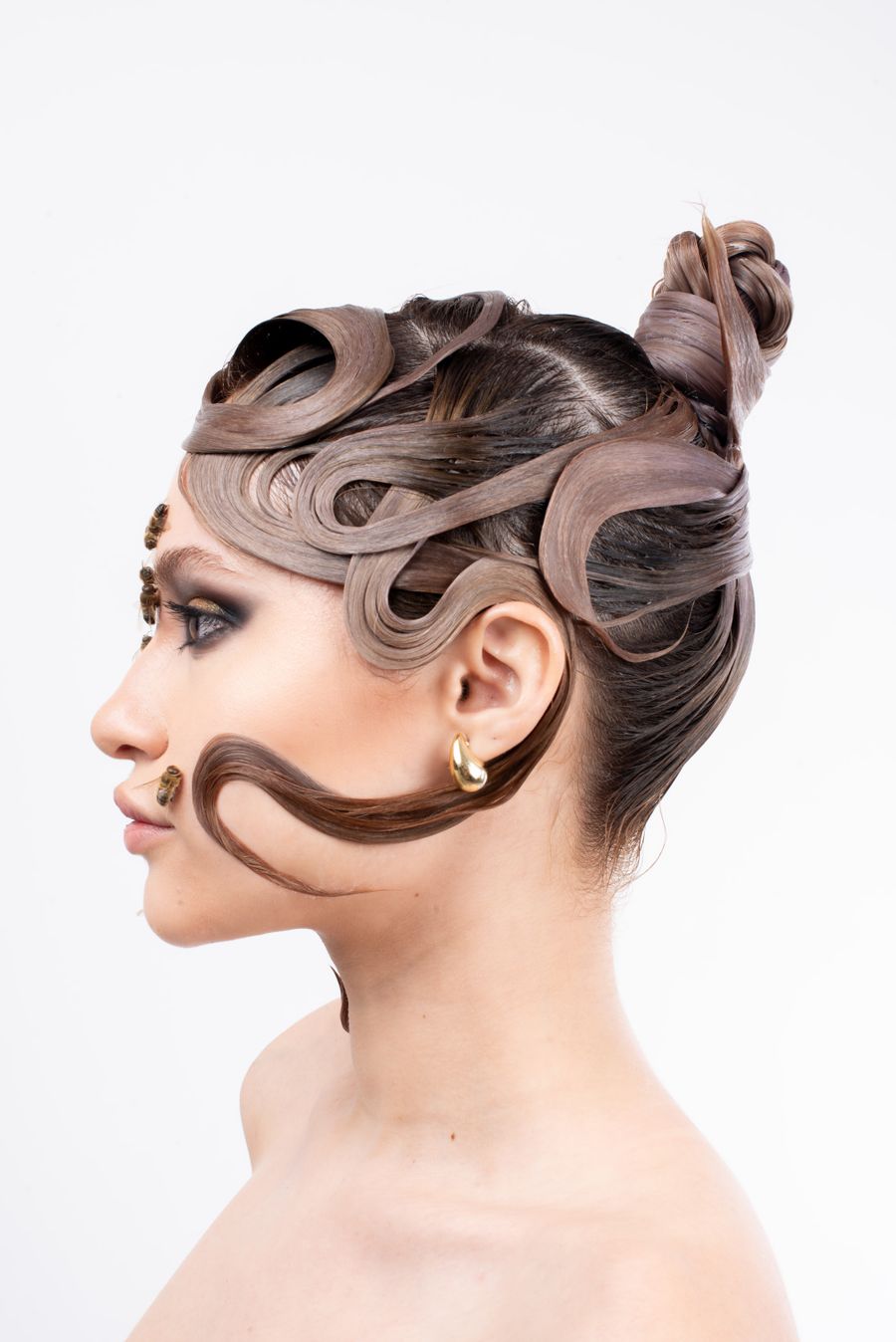 Editorial portrait showcasing an intricate hairstyle