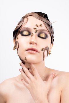 Artistic portrait of a woman with bees and bold makeup, showcasing intricate beauty and fashion details.