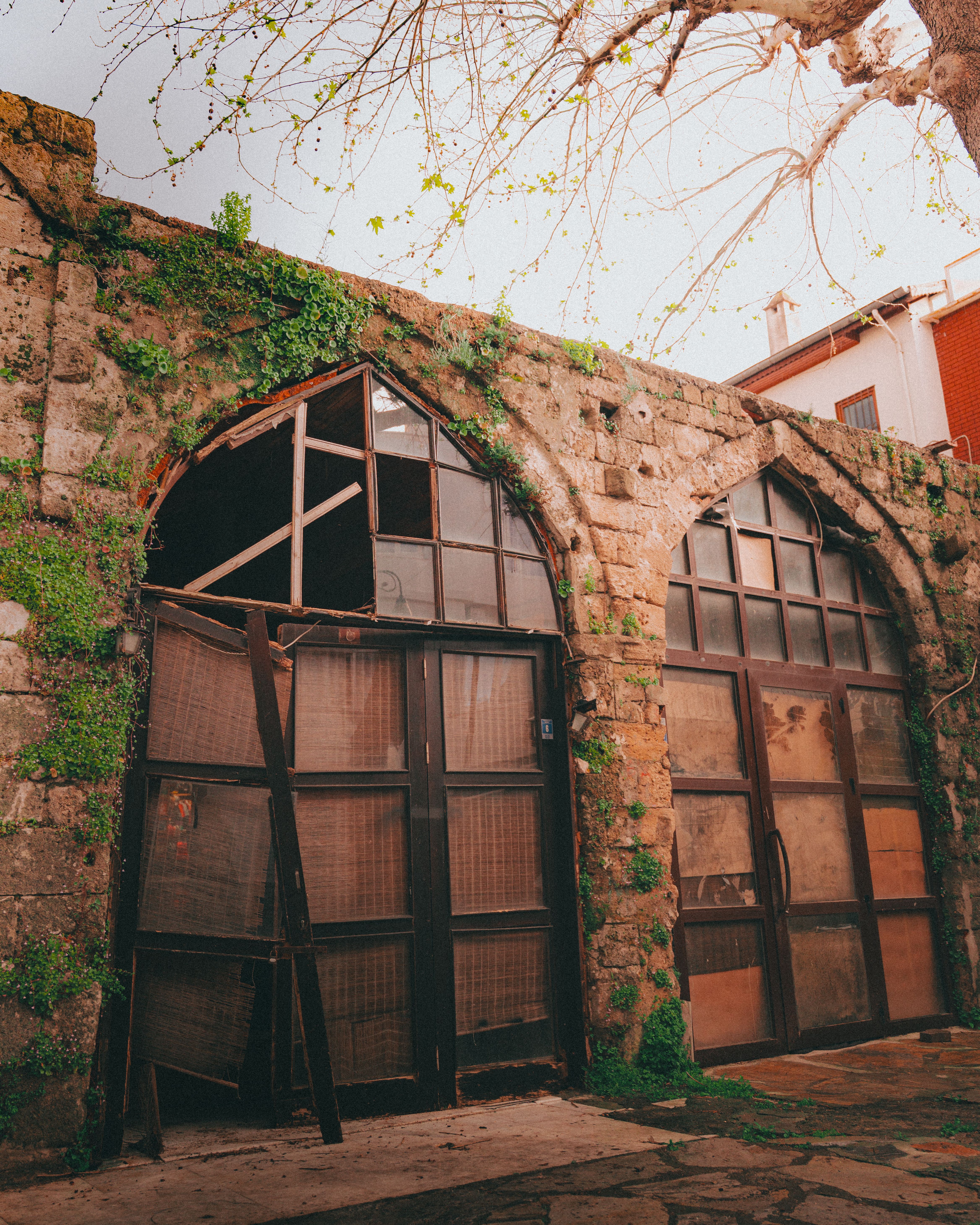 Historic Stone Building with Arched Windows · Free Stock Photo