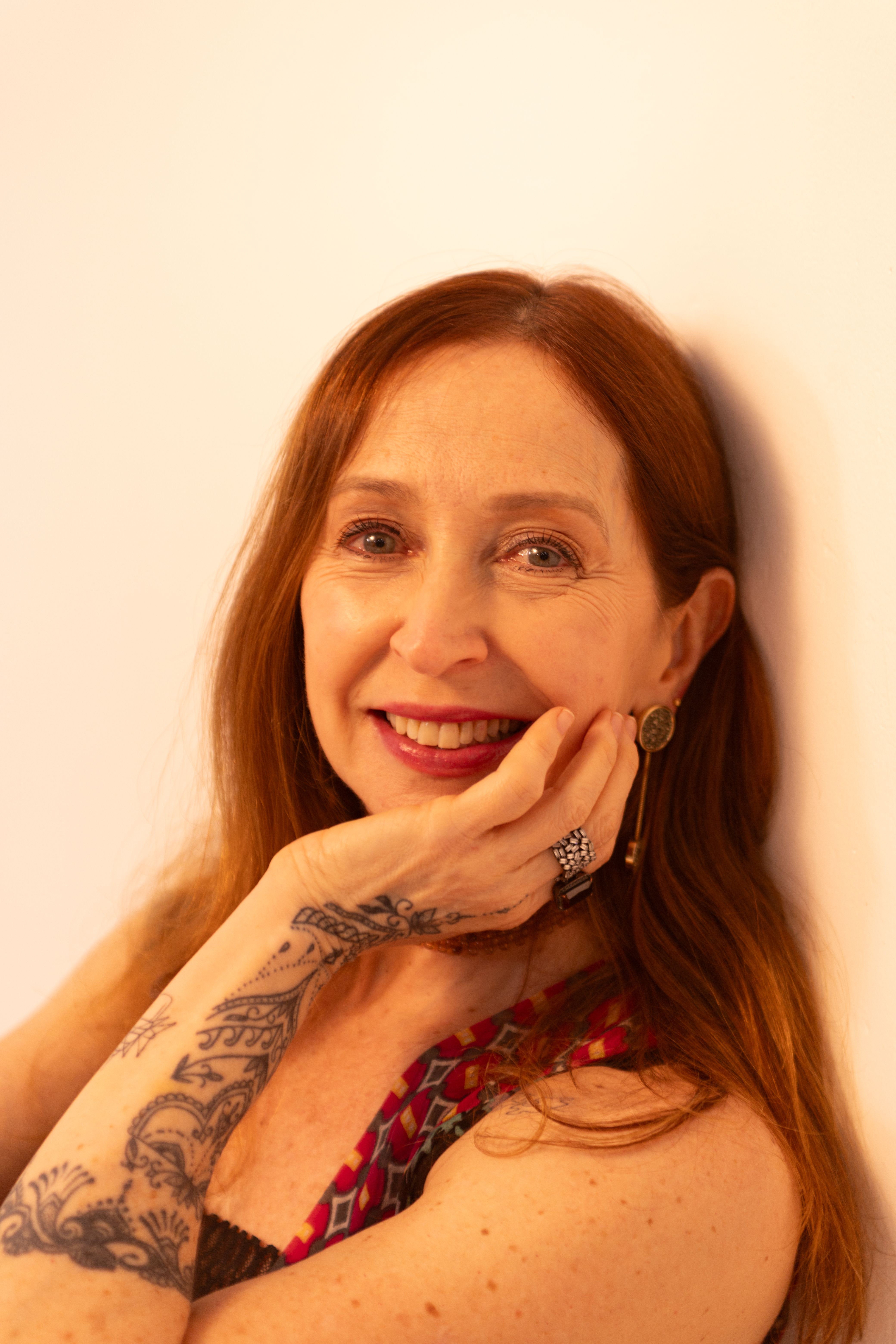 Portrait of a senior woman showing confidence and style with her unique tattoo and smile.