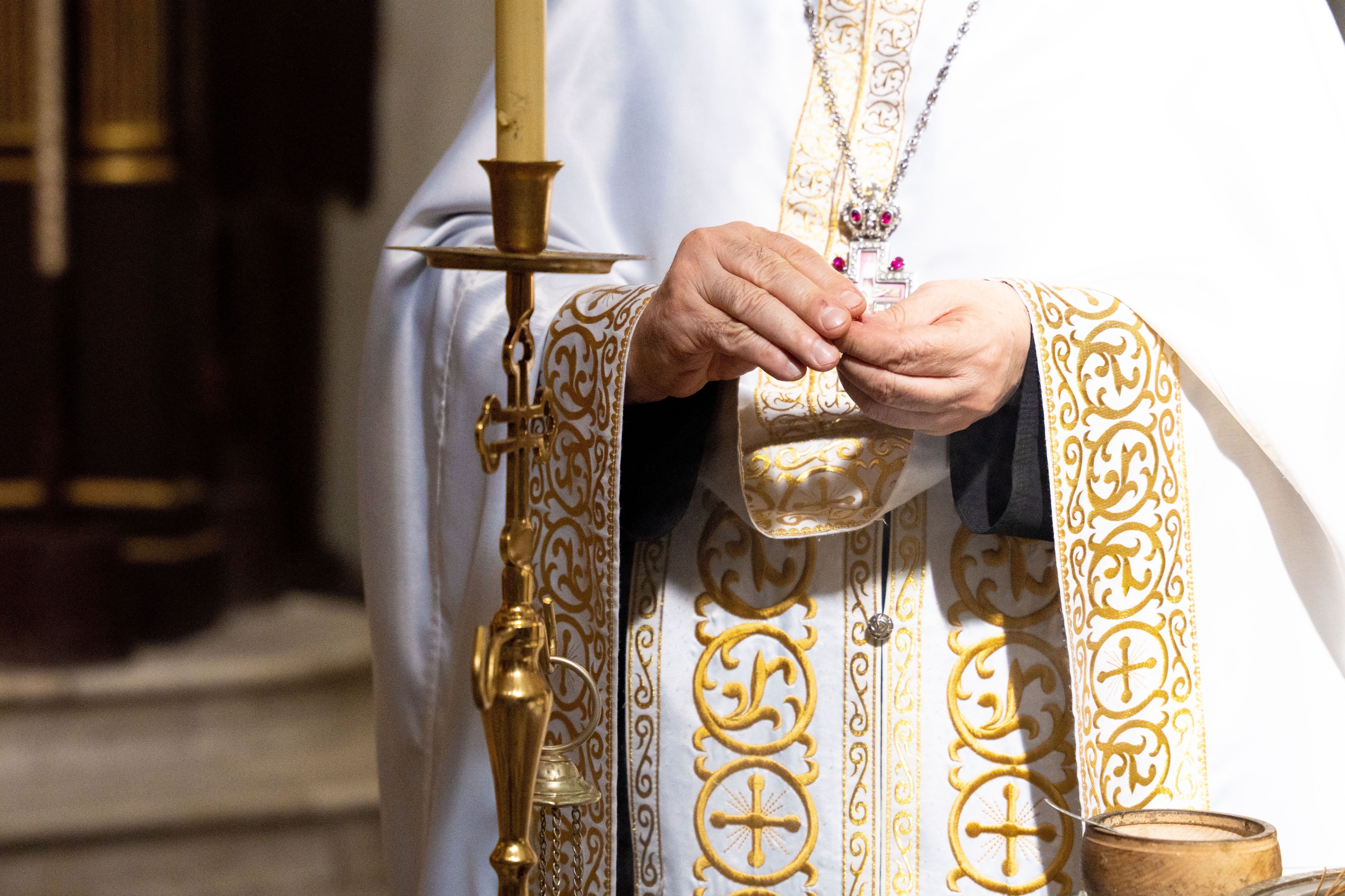 Priest Performing Sacred Ritual in Church · Free Stock Photo