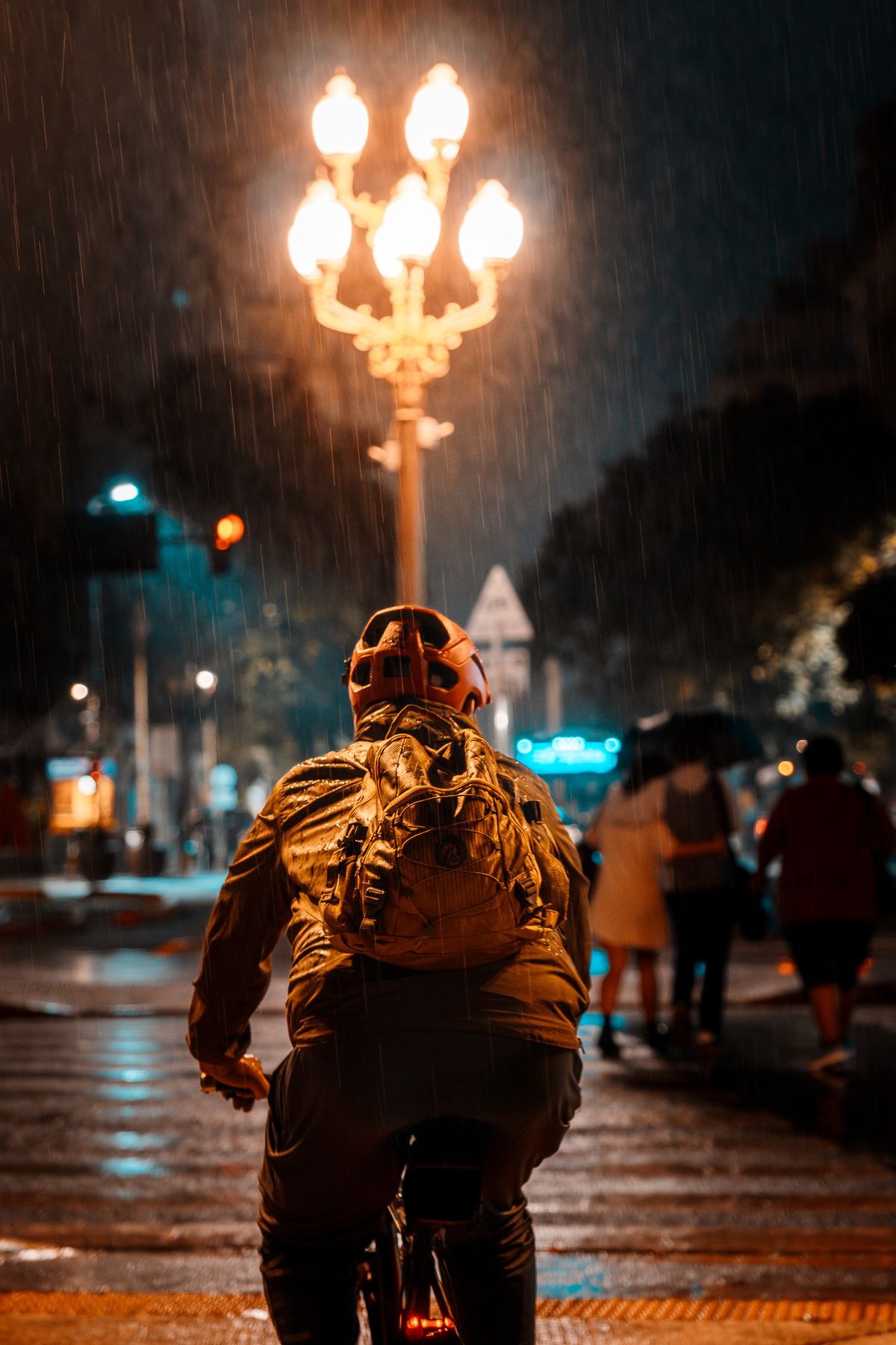 Cyclist commuting through a city in low-light conditions