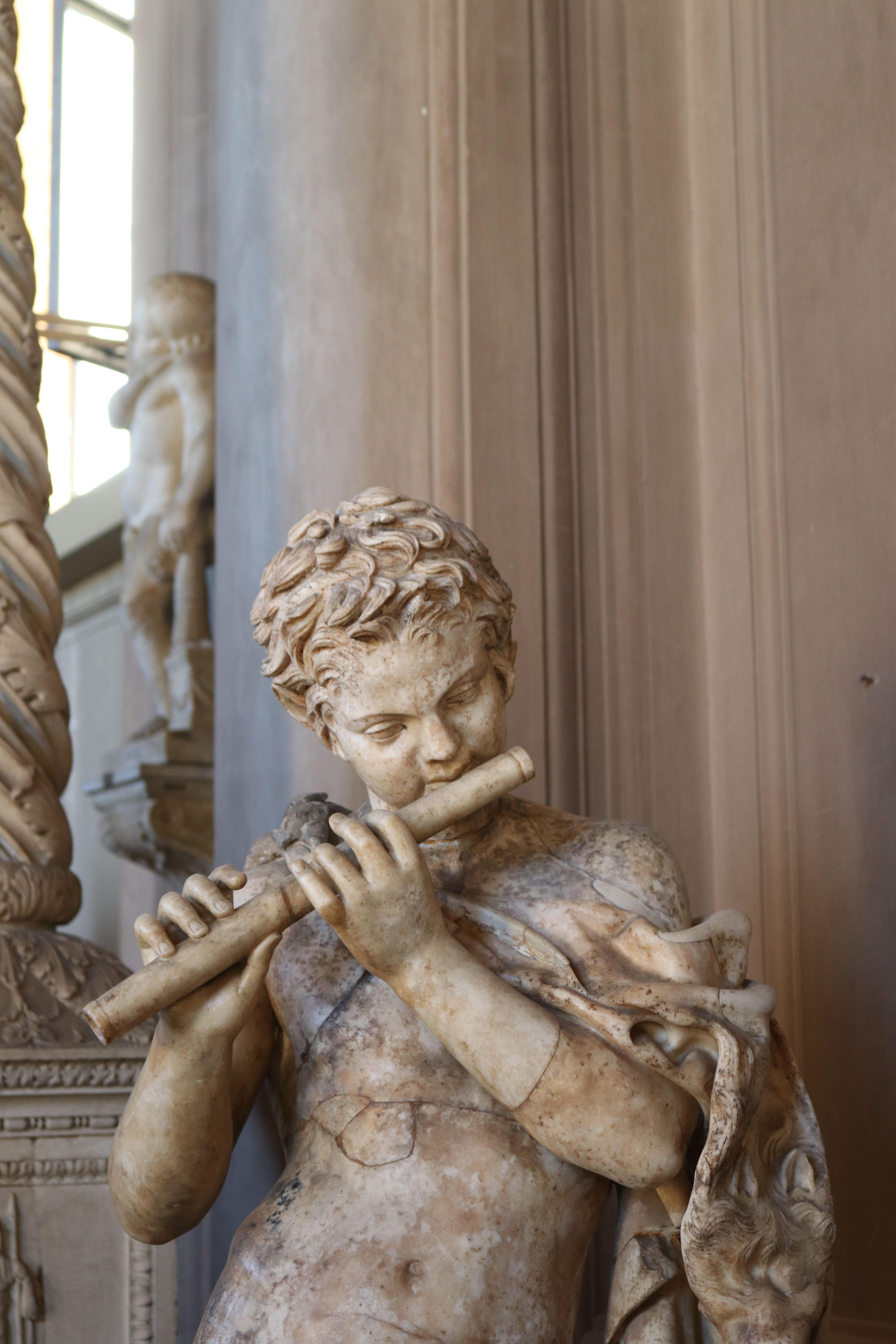 Ancient Roman Flute Player Sculpture in Vatican · Free Stock Photo