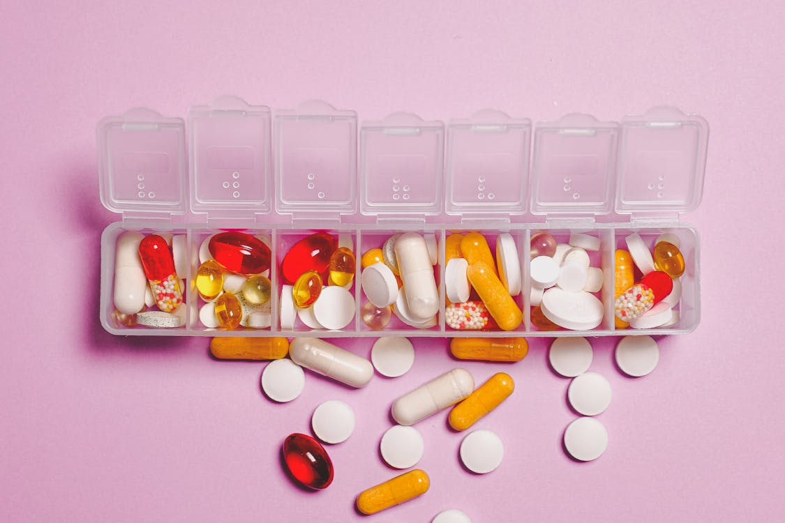 Free Clear Plastic Container and Medicine Capsule Stock Photo