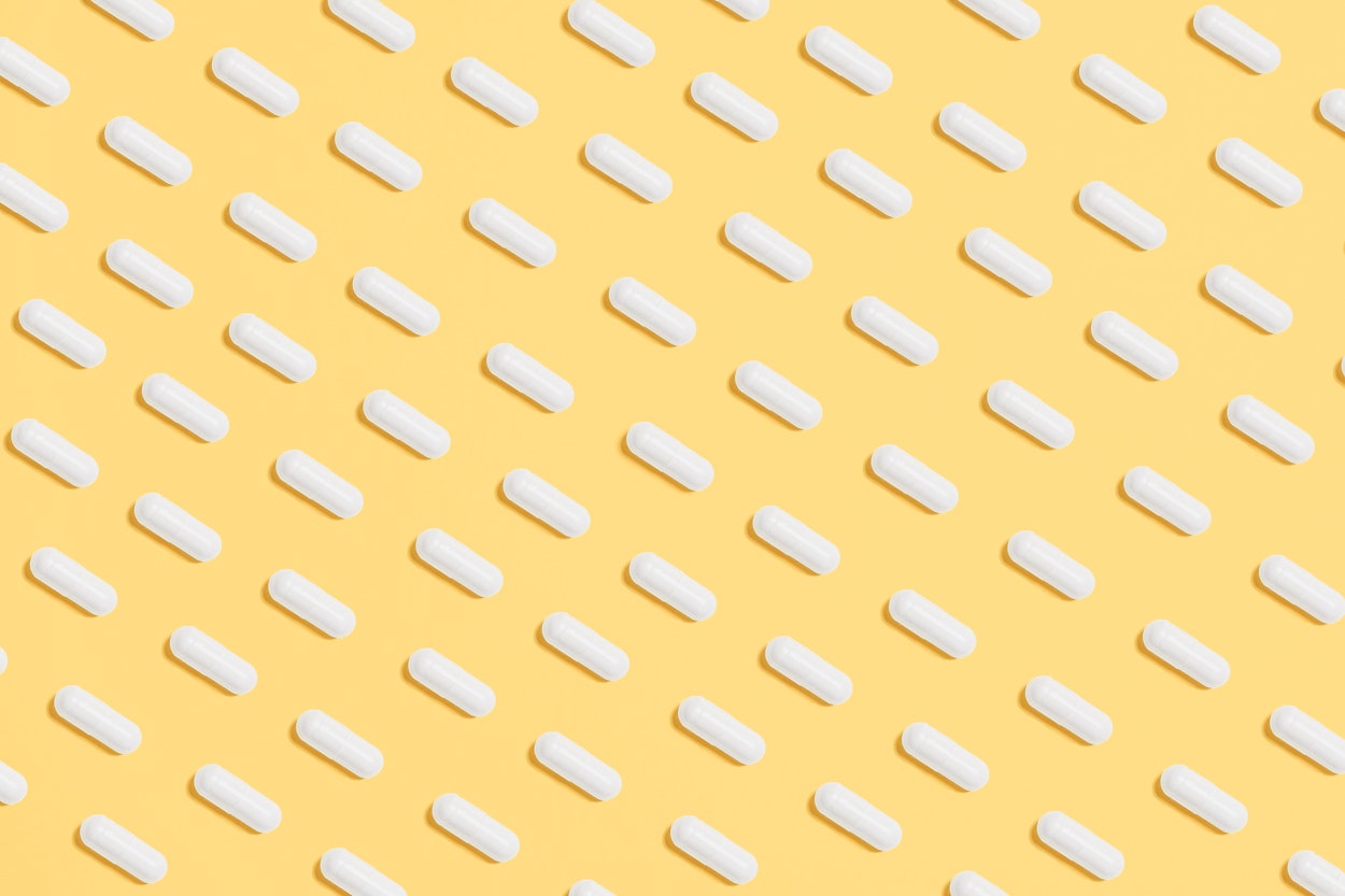 Organized medication management tools including pill organizer, planner, and digital health tracking resources