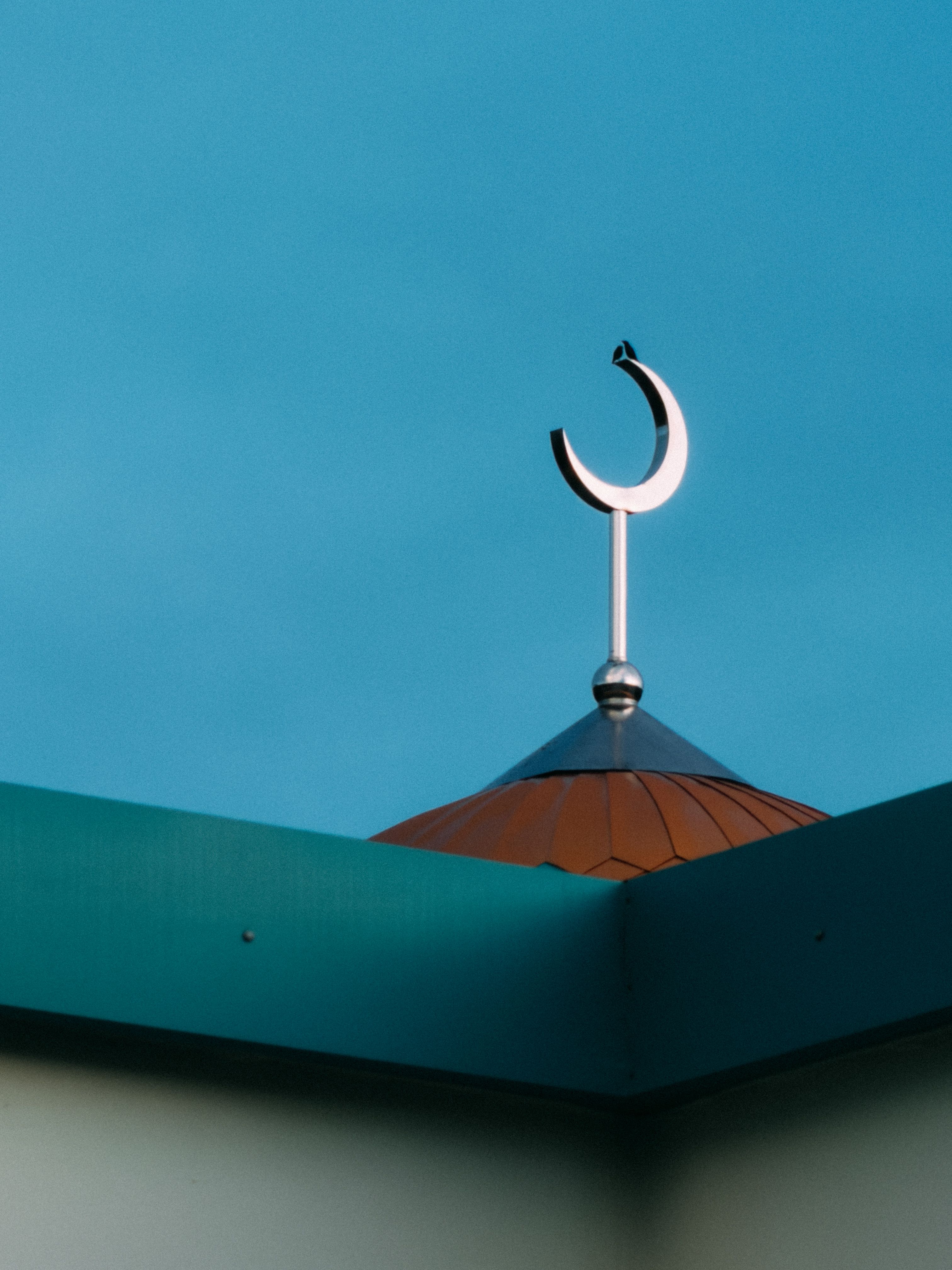 Crescent Moon Symbol atop Mosque in Clear Sky · Free Stock Photo