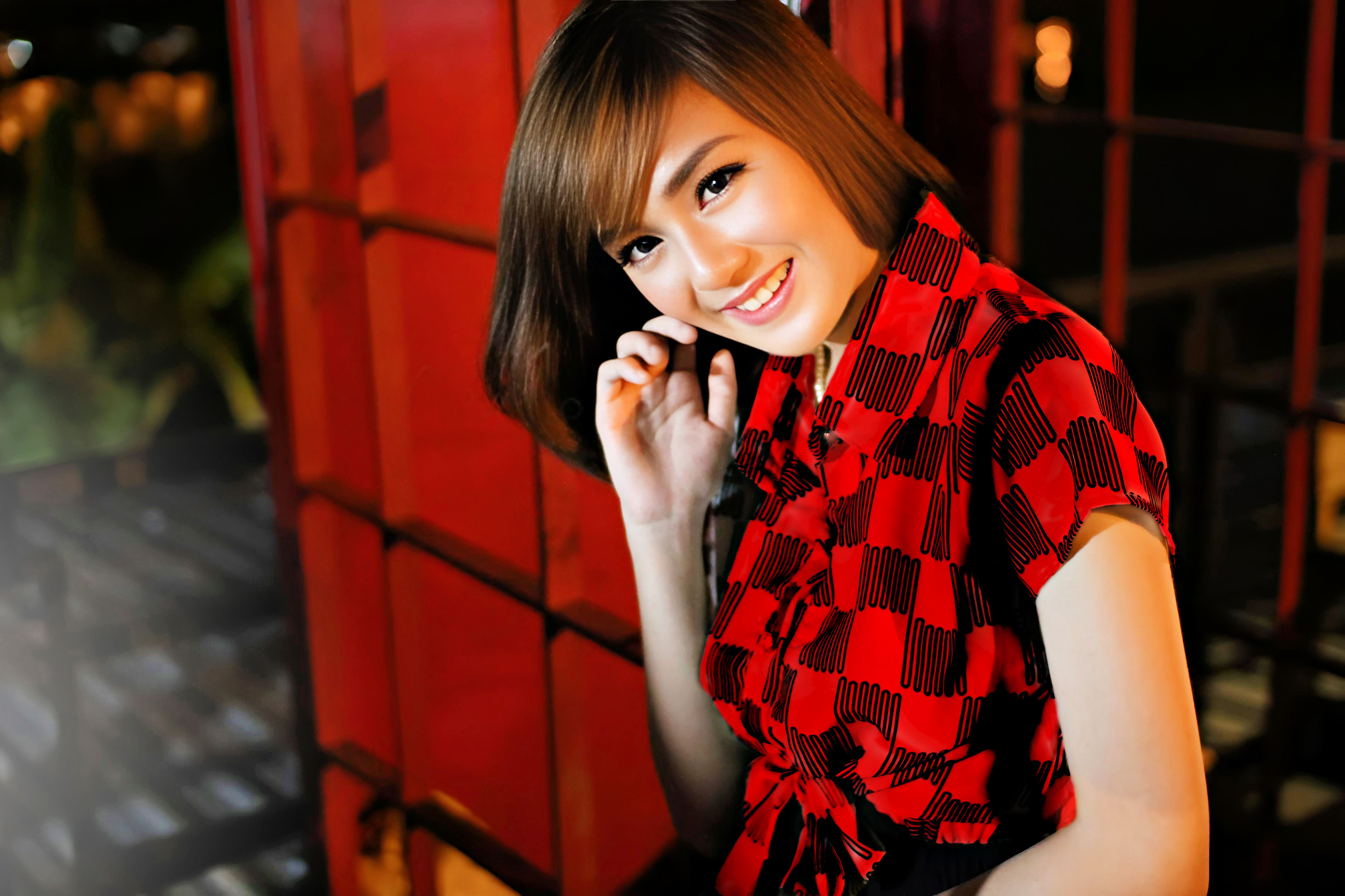Portrait of a Smiling Woman in Red Dress