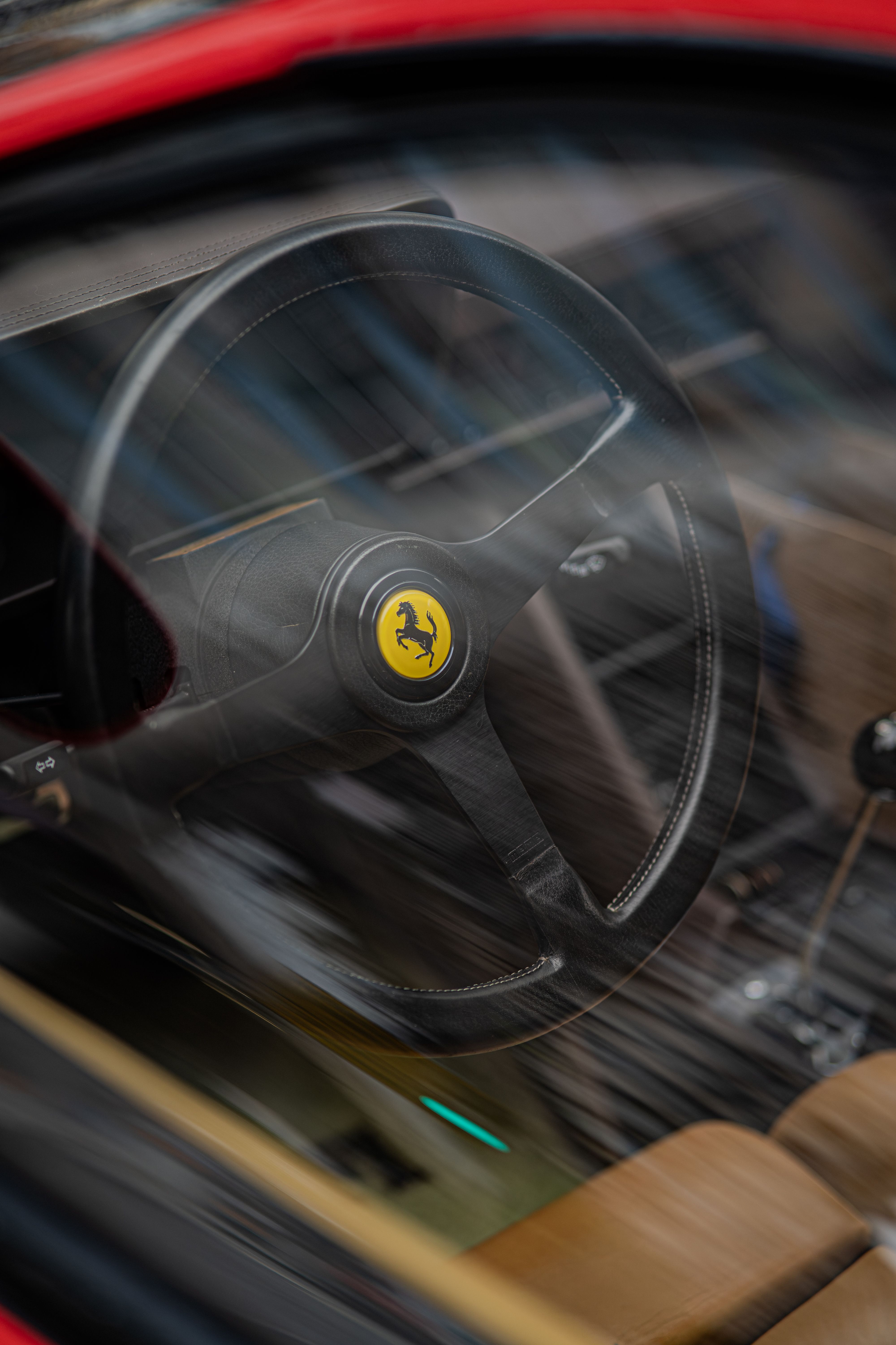 Close-up of Luxury Sports Car Steering Wheel · Free Stock Photo
