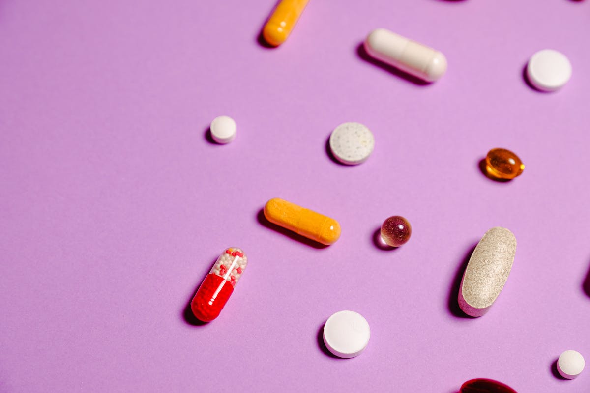 Person writing a health tracker journal at a desk