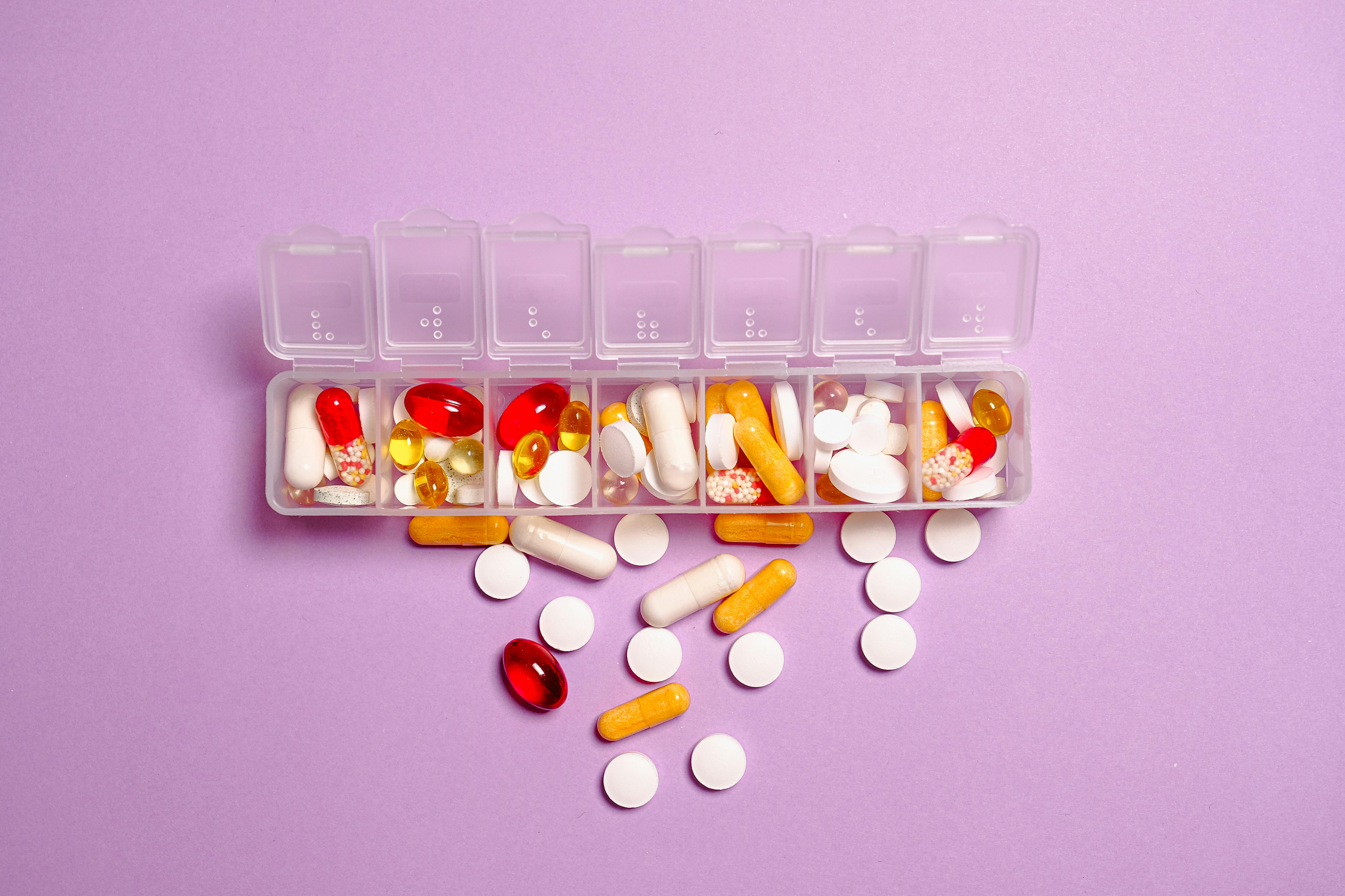 Free Photo Medication Pills on White Plastic Container Stock Photo