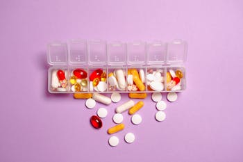 Photo Medication Pills on White Plastic Container