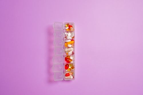 Assorted Medicines in Clear Plastic Container