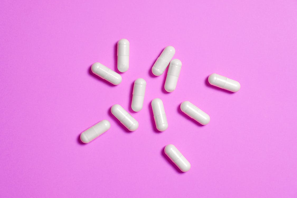 Free White Medicine Capsule in Close-up Photography Stock Photo