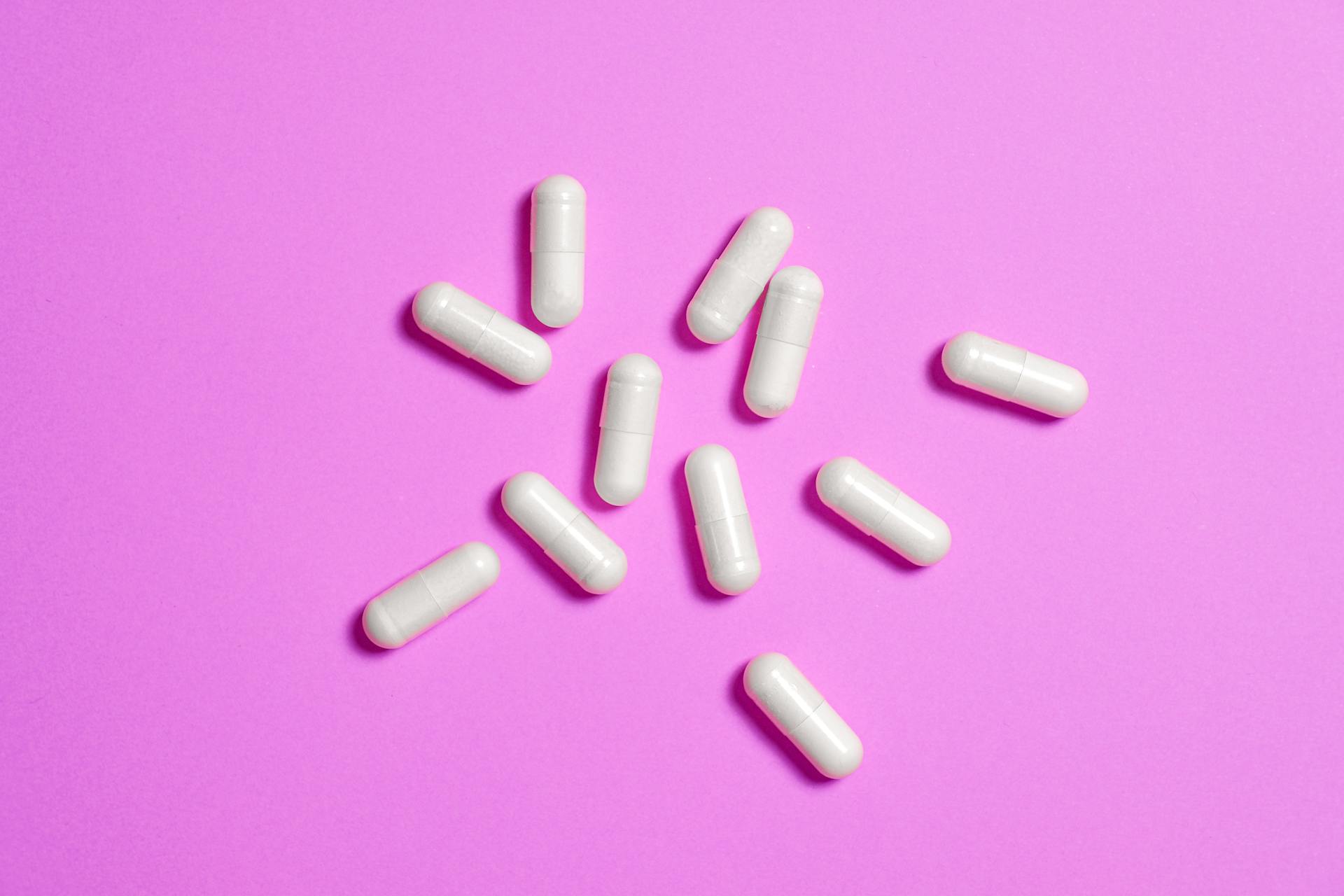 White Medicine Capsule in Close-up Photography