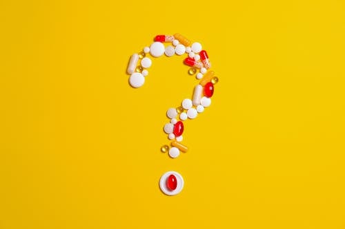 Medication Pills Isolated on Yellow background