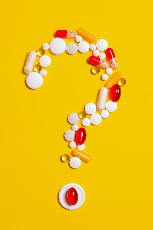 Medication Pills on Yellow background