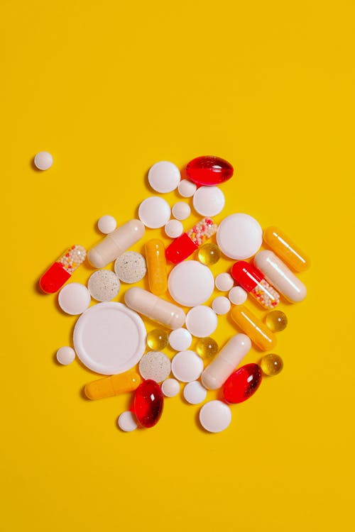 Free Yellow Surface and Supplement Capsule Stock Photo