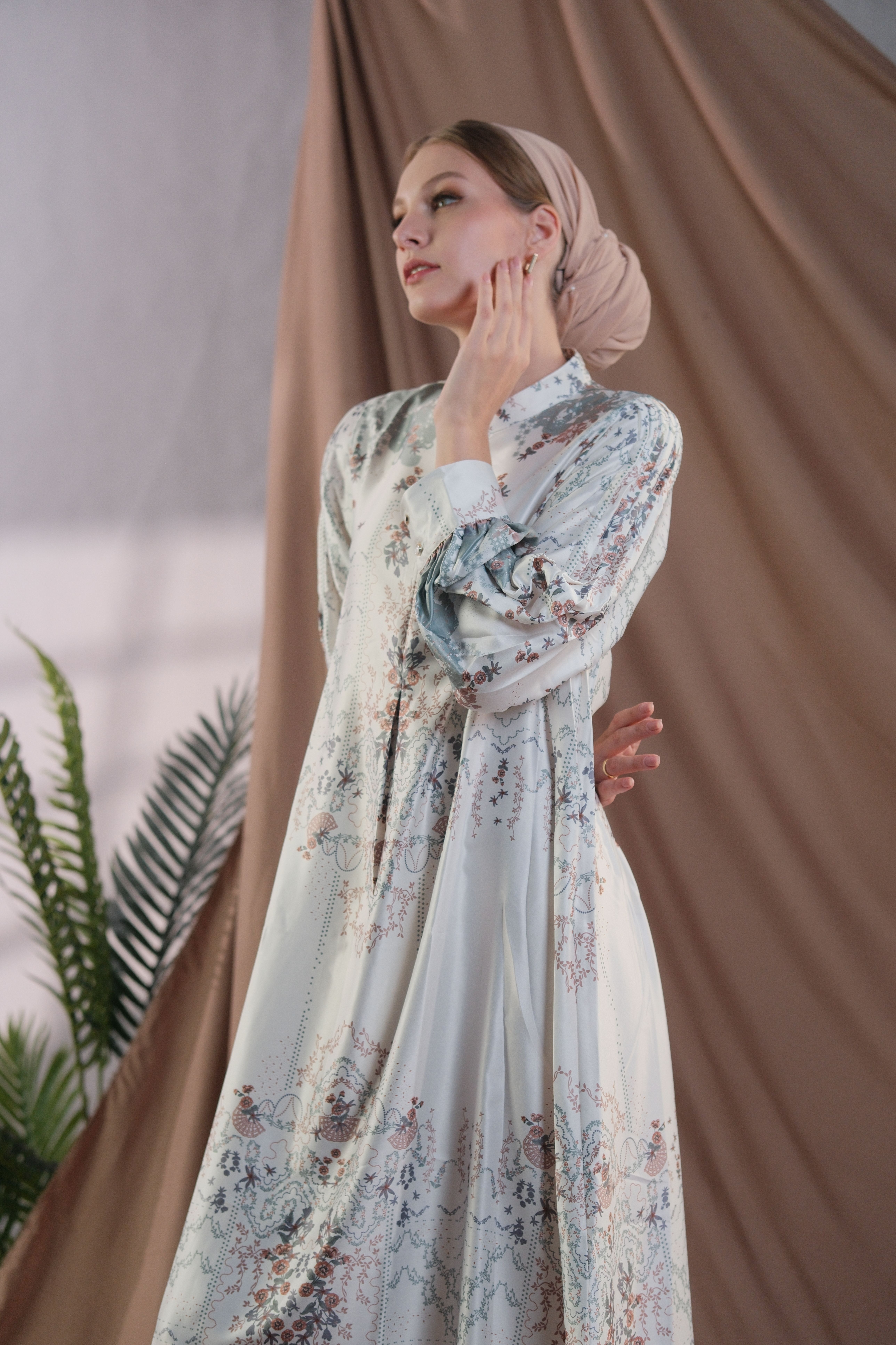 Elegant Woman in a Floral Dress Indoors · Free Stock Photo