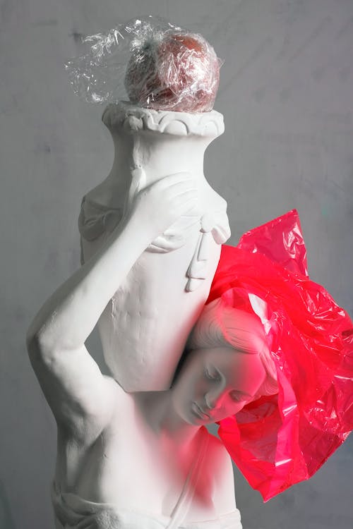 Life Size Ceramic Statue With Red Plastic
